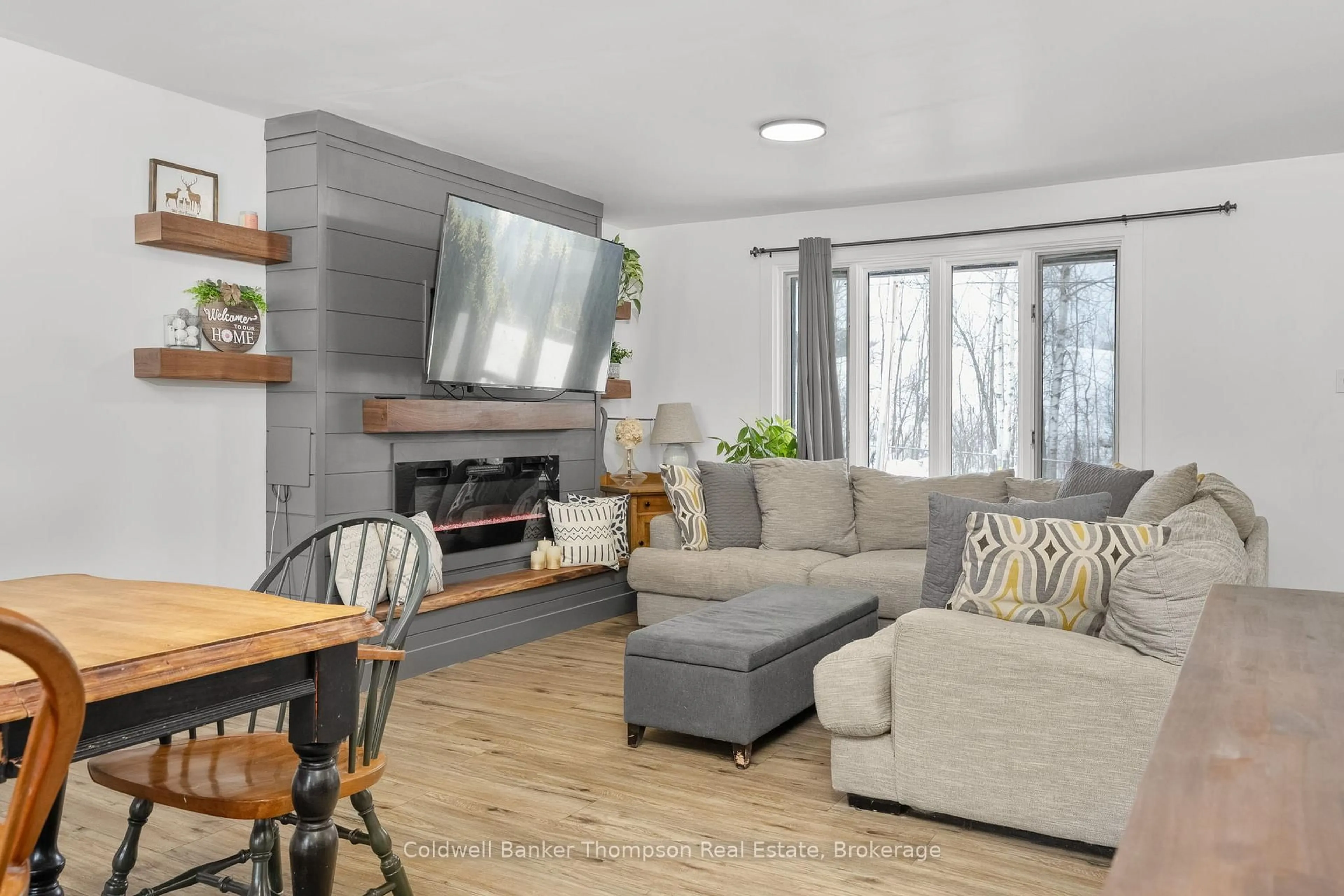 Living room with furniture, wood/laminate floor for 6 Kitchen Rd, Huntsville Ontario P1H 1Y1