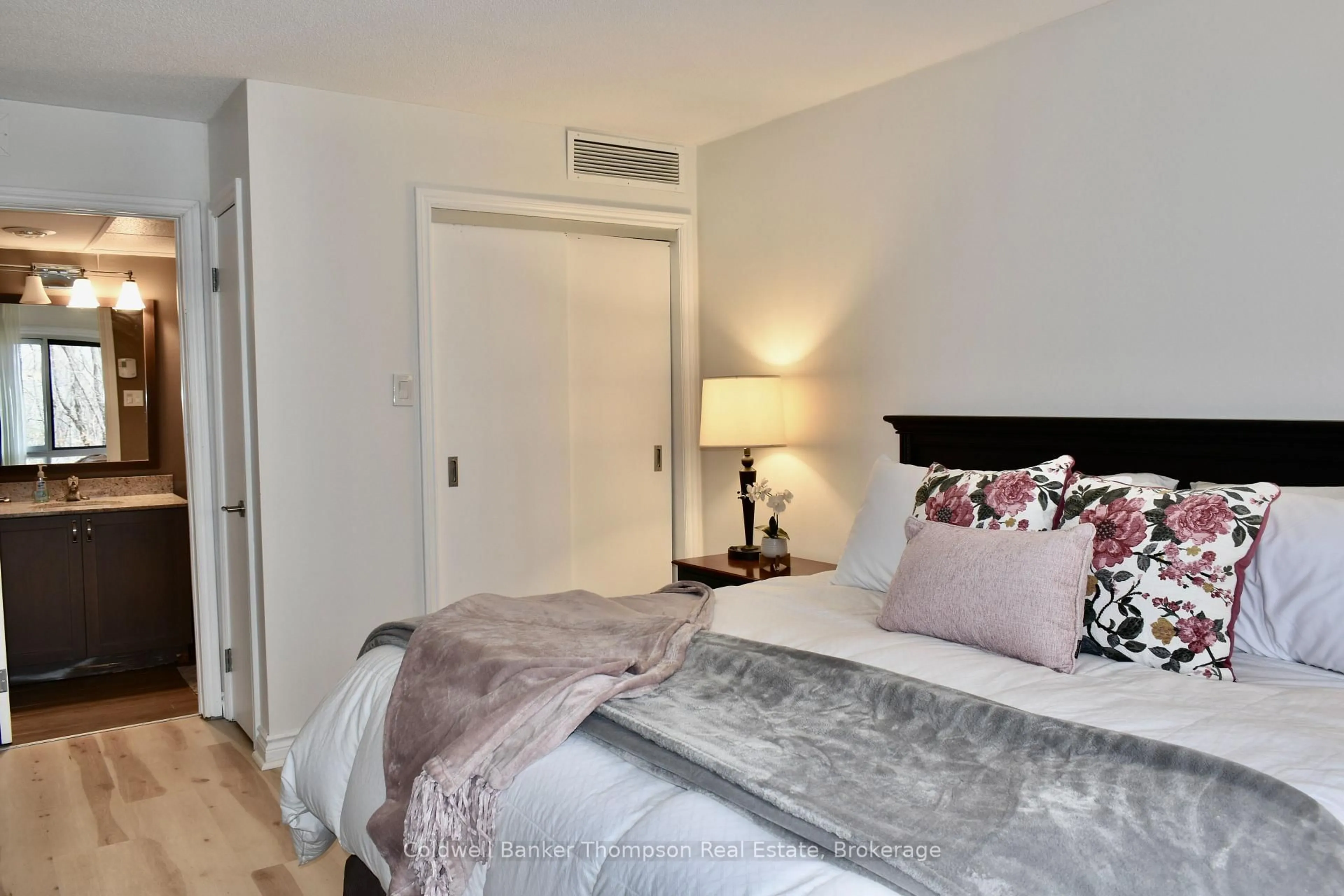 Bedroom with bed, wood/laminate floor for 23-205 MAPLERIDGE DEERHURST Dr, Huntsville Ontario P1H 1A9