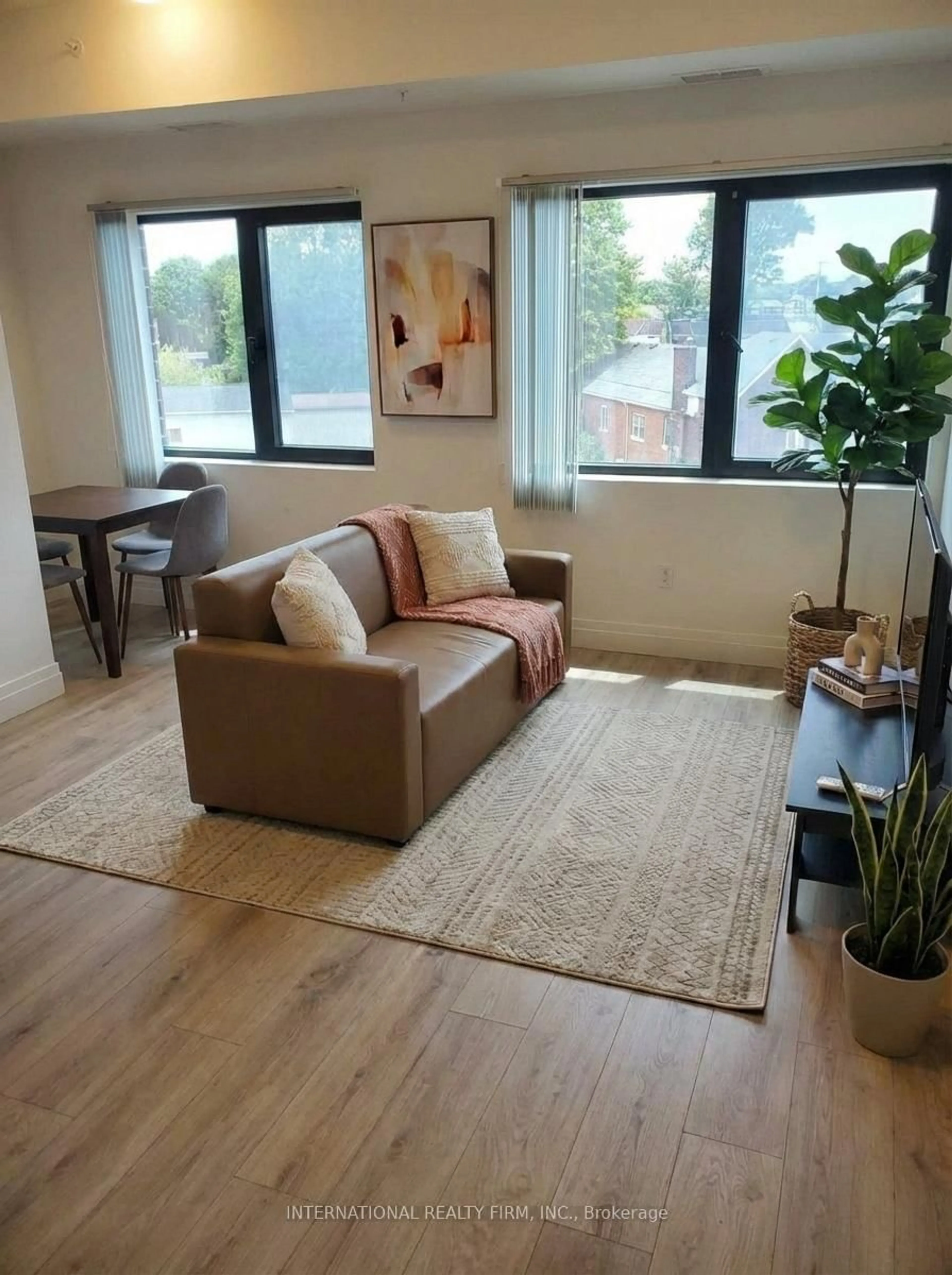 Living room with furniture, wood/laminate floor for 652 Princess St #425, Kingston Ontario K7L 1E5