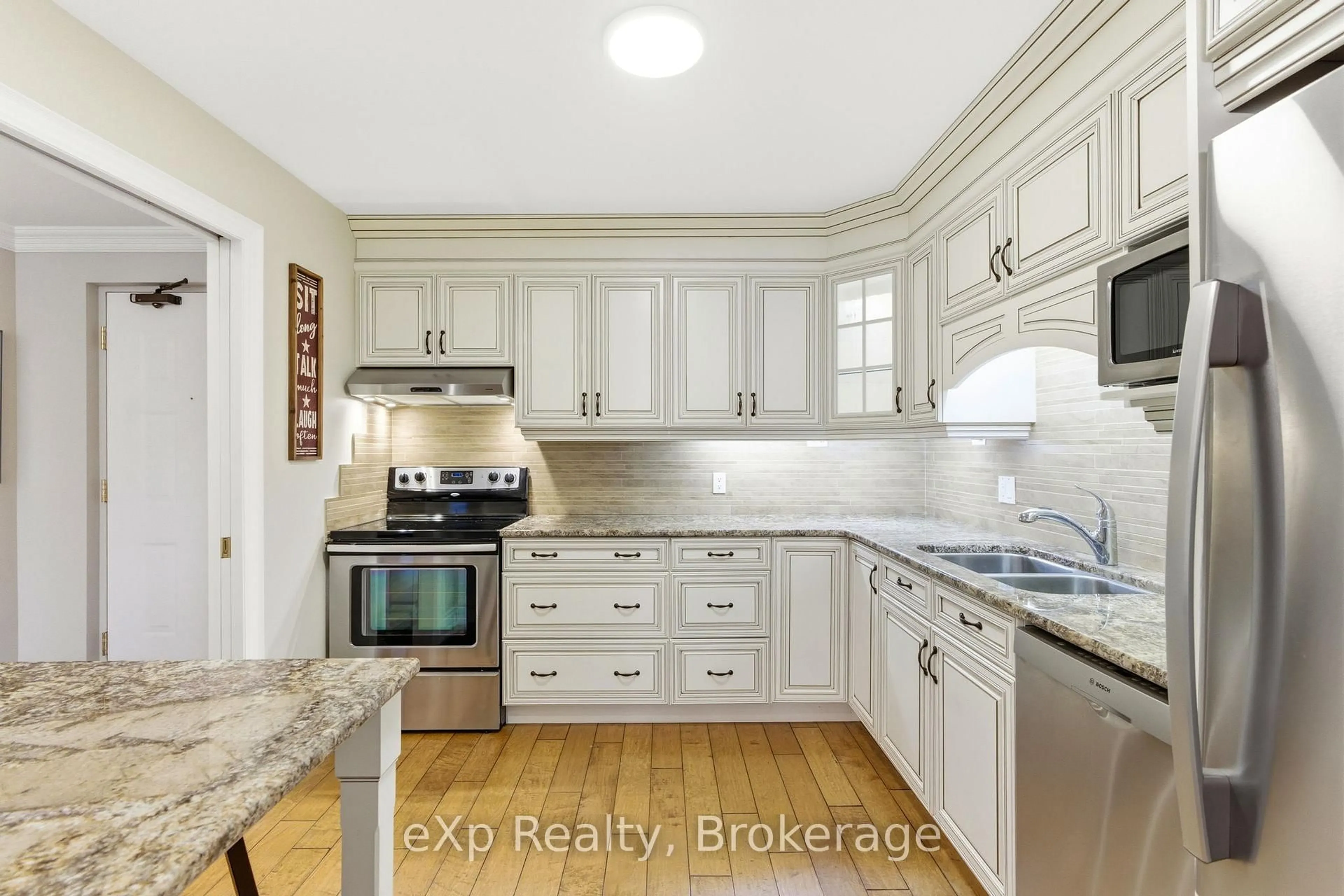 Open concept kitchen, ceramic/tile floor for 30 Front St #206, Stratford Ontario N5A 7S3