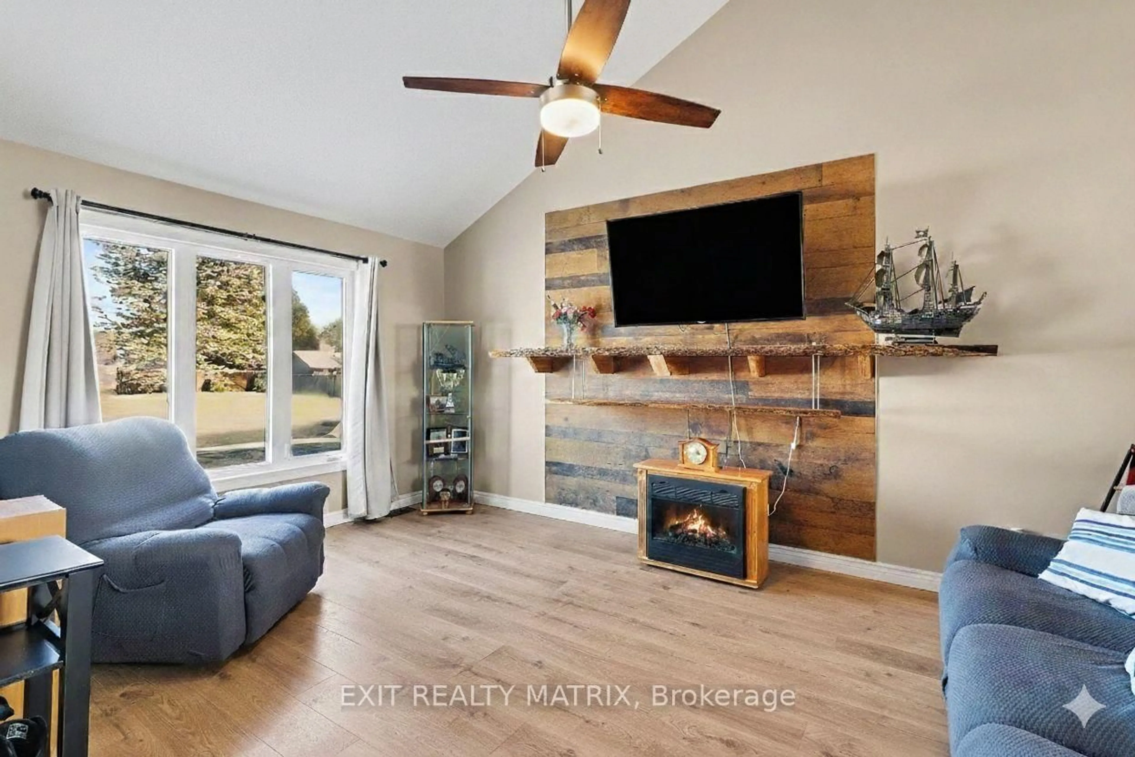 Living room with furniture, wood/laminate floor for 51 Marcel St, Russell Ontario K0A 1W0