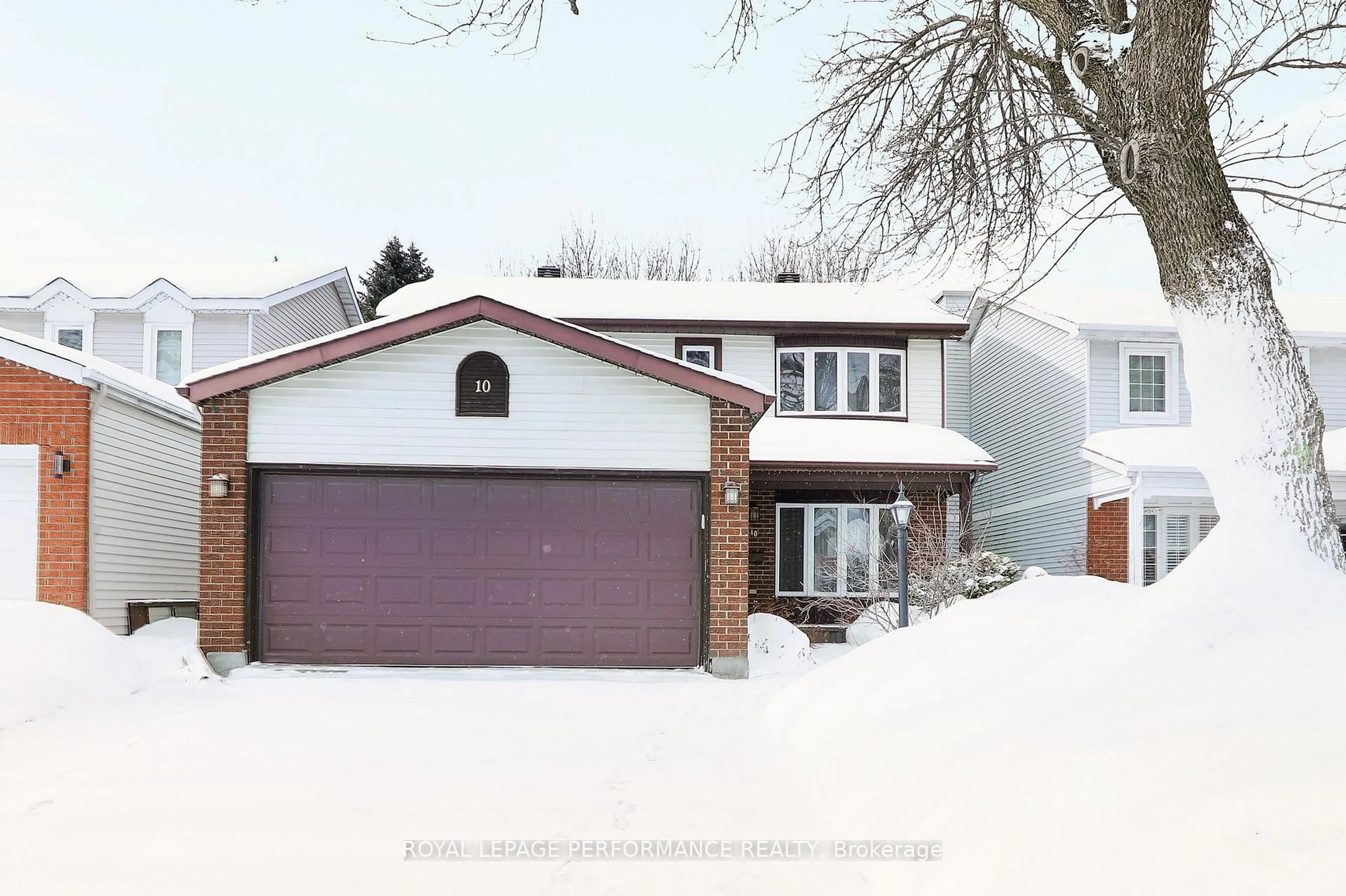 Home with vinyl exterior material, street for 10 Ellisson Way, Ottawa Ontario K1G 4N8