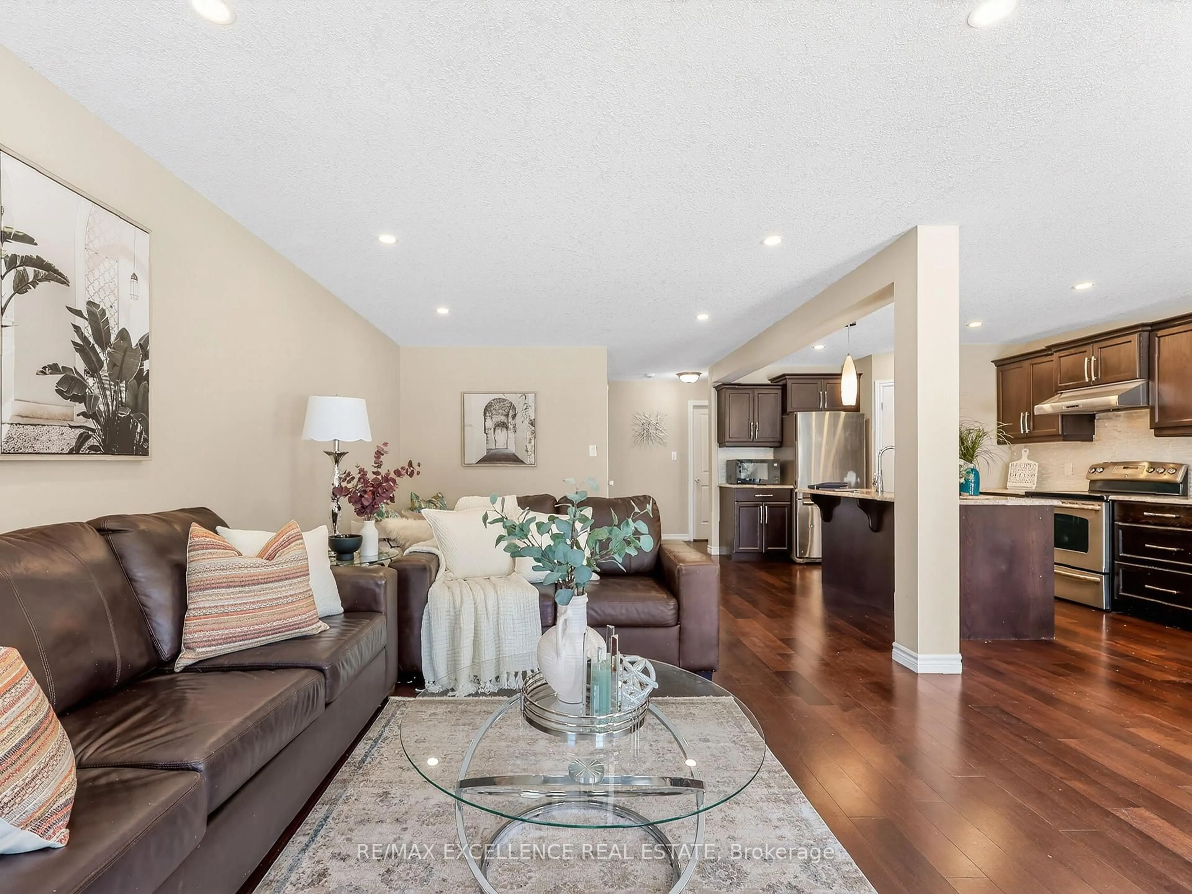 Living room with furniture, wood/laminate floor for 3329 CASSON Way, London South Ontario N6L 0B9