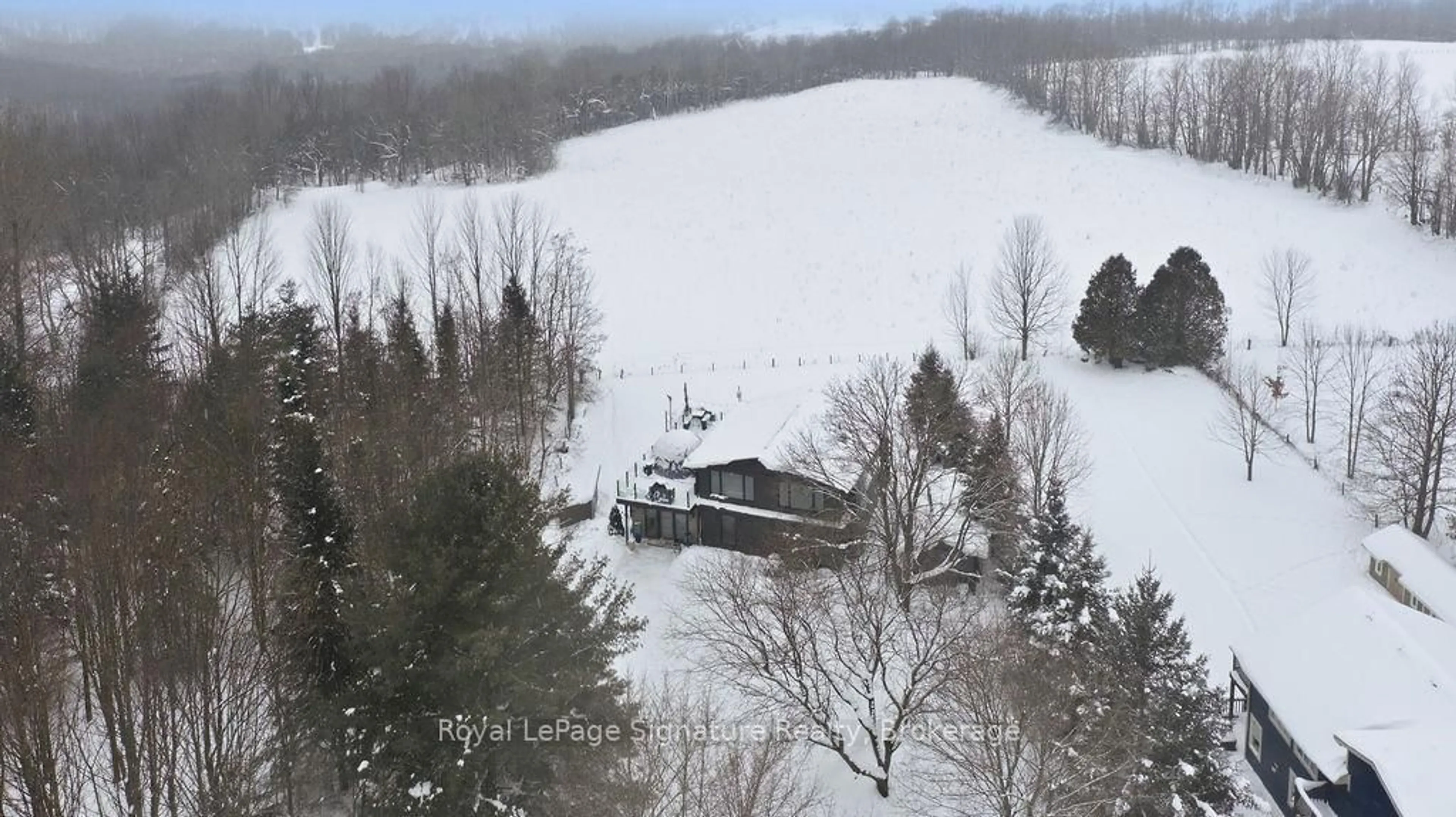 A pic from outside/outdoor area/front of a property/back of a property/a pic from drone, mountain view for 194552 13 GREY Rd, Grey Highlands Ontario N0C 1E0