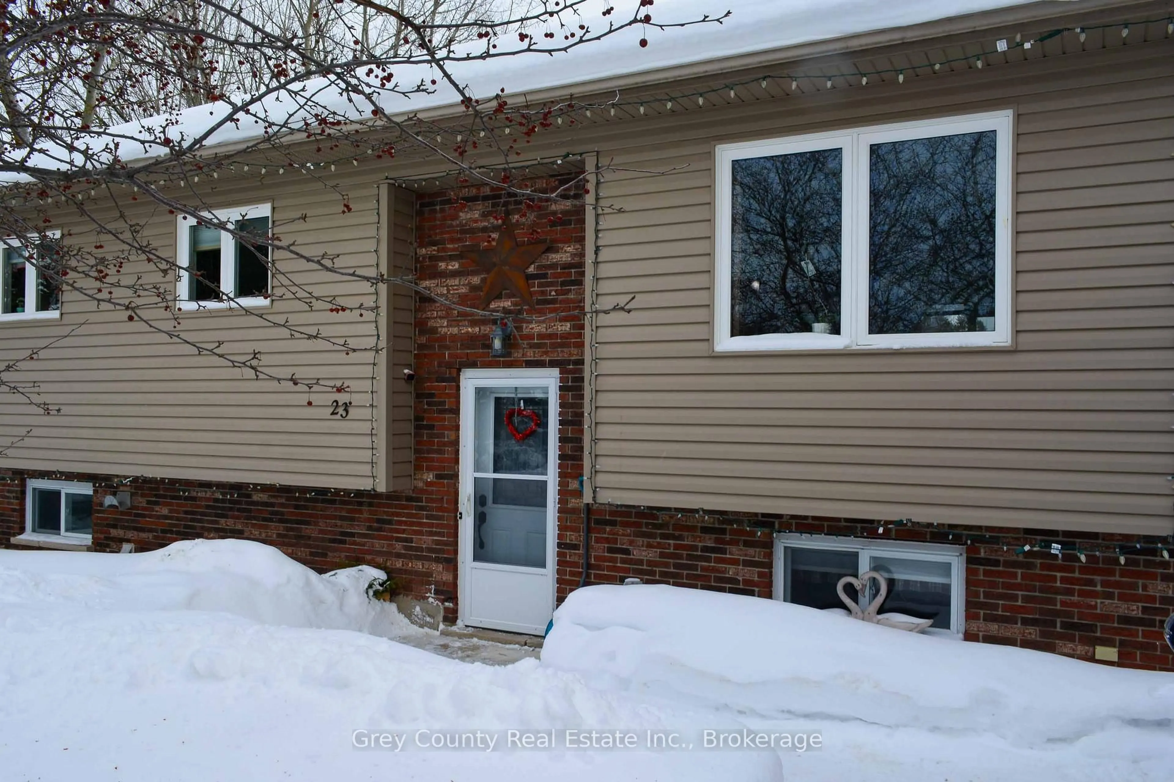 Home with vinyl exterior material, street for 23 Brackenbury St, Grey Highlands Ontario N0C 1H0