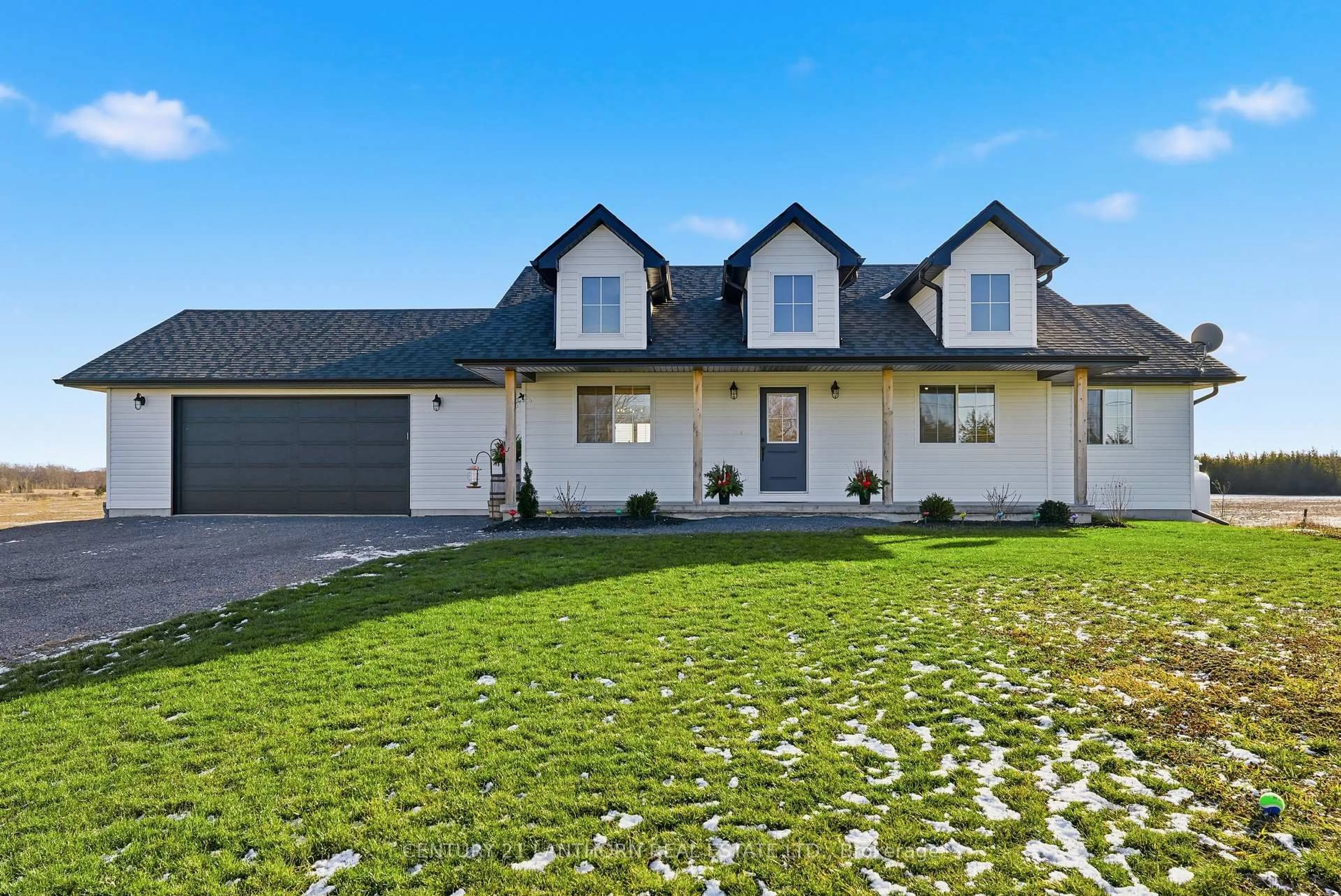 Home with vinyl exterior material, street for 1232 County Road 7, Prince Edward County Ontario K0K 2T0