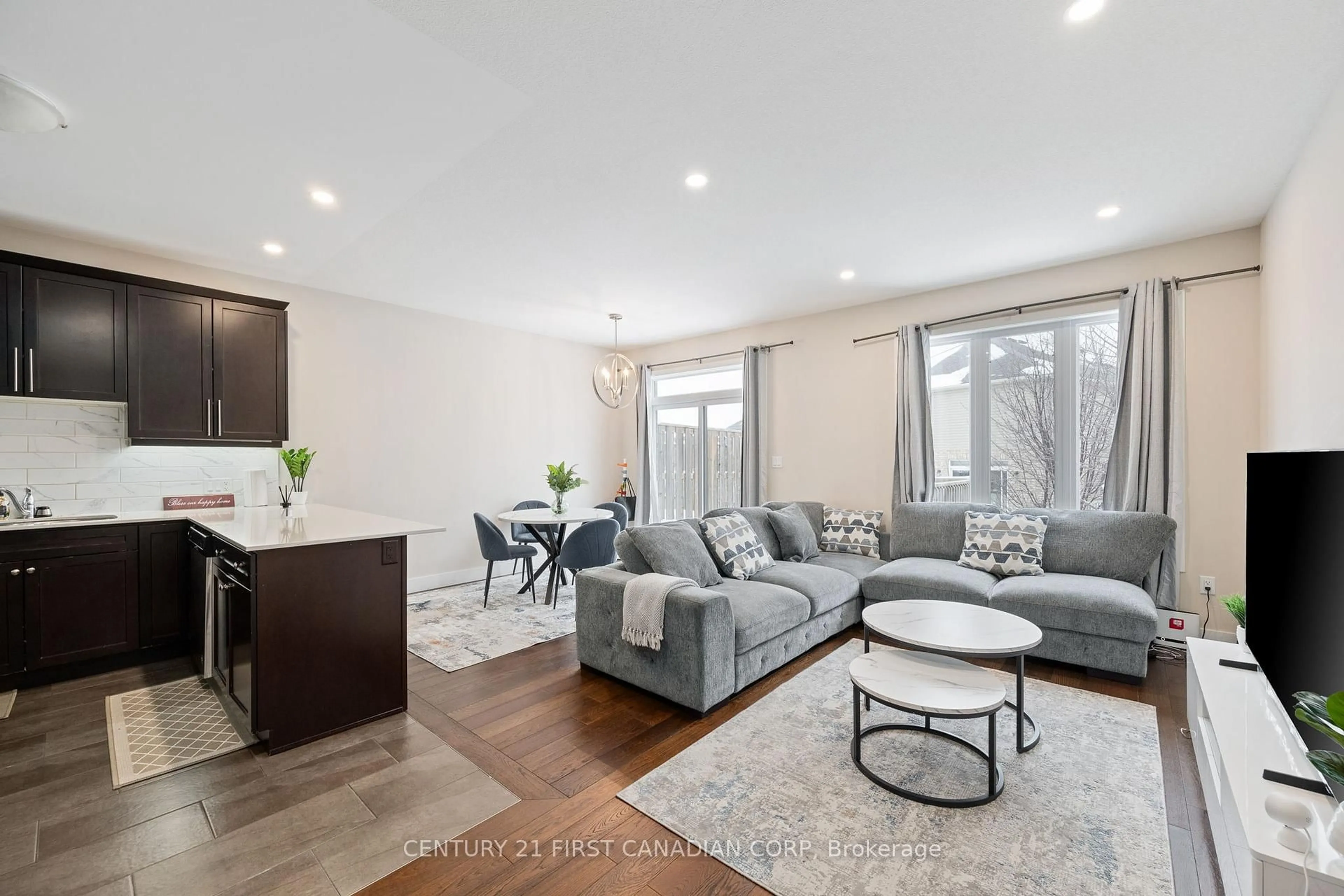 Living room with furniture, wood/laminate floor for 1960 Dalmagarry Rd #195, London North Ontario N6G 0T8