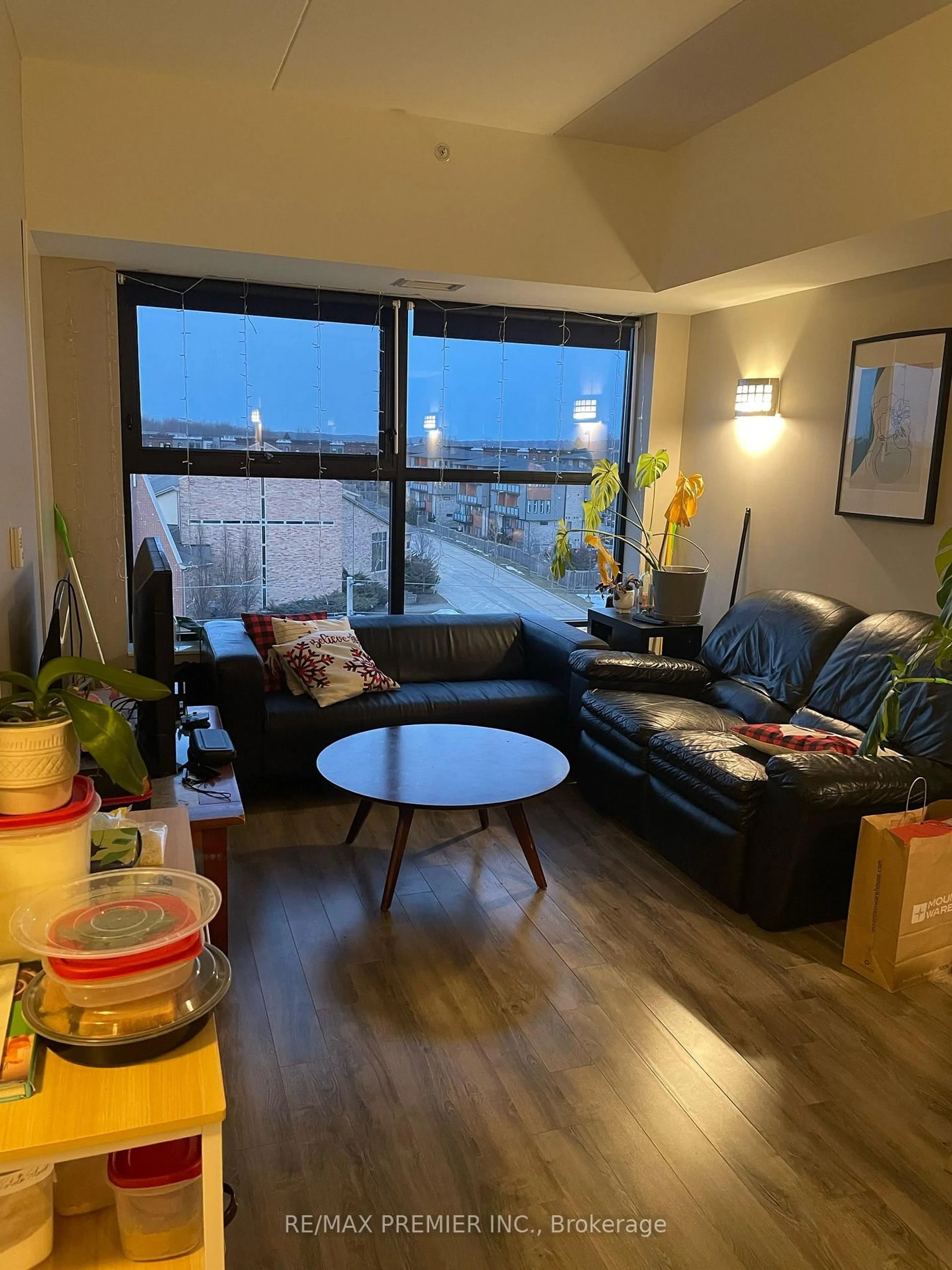 Living room with furniture, wood/laminate floor for 1291 Gordon St #608, Guelph Ontario N1L 0M5