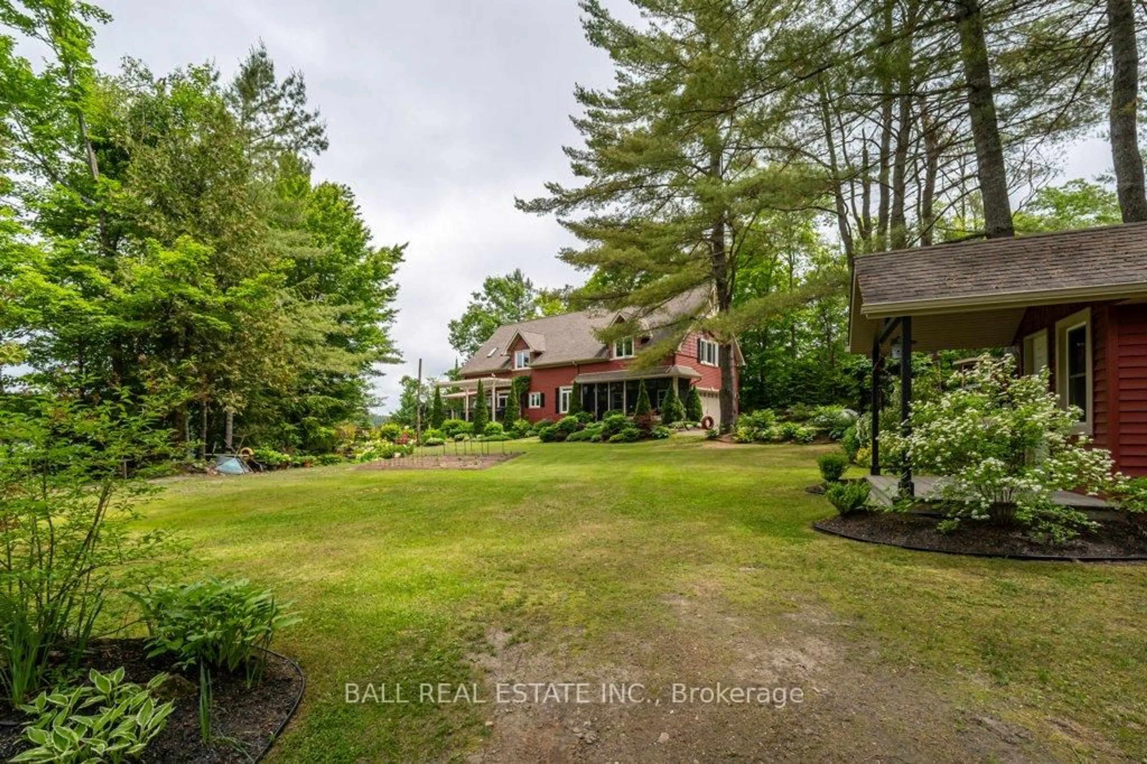 A pic from outside/outdoor area/front of a property/back of a property/a pic from drone, unknown for 32 Shadowood Lane, North Kawartha Ontario K0L 1A0