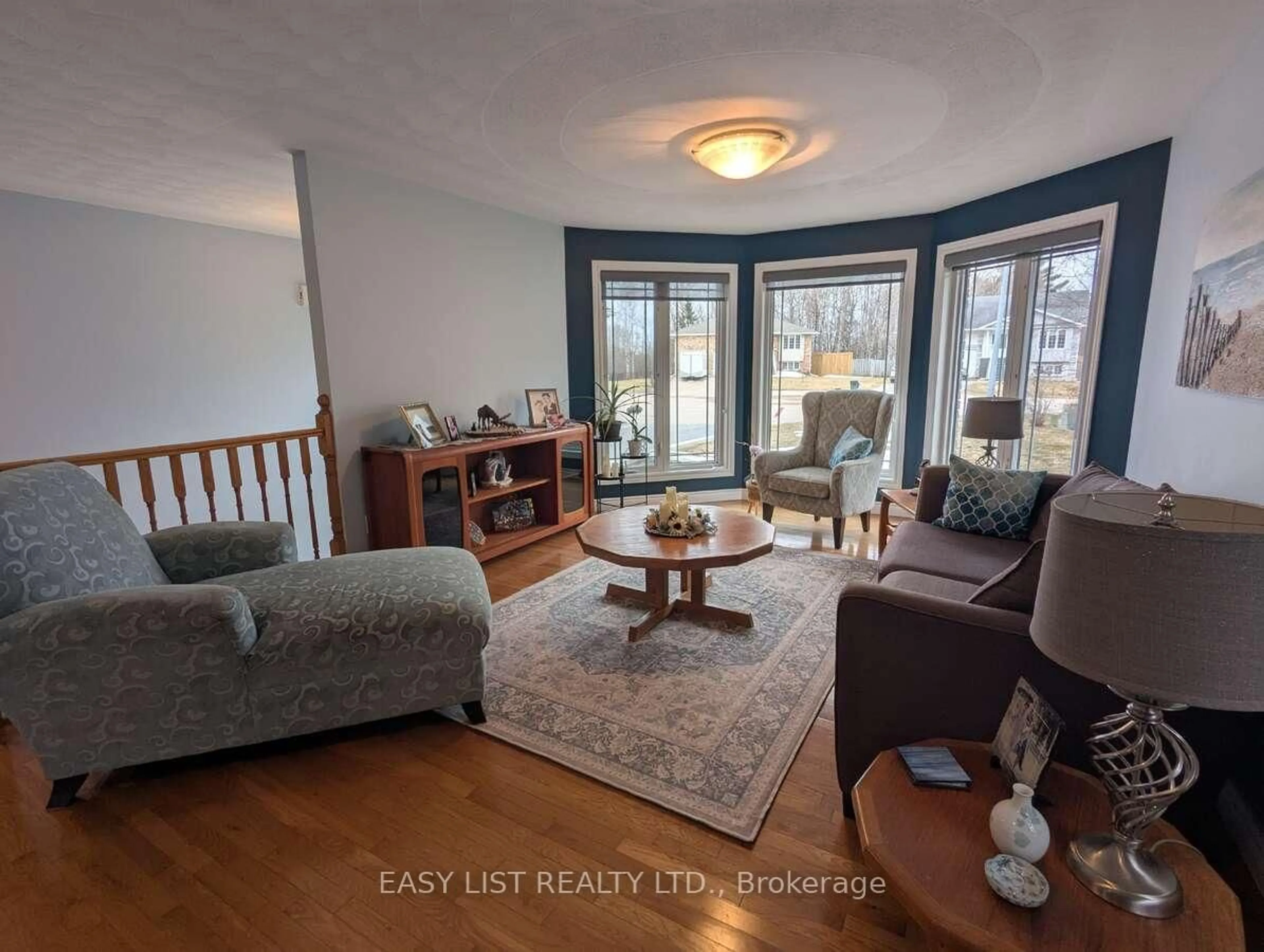 Living room with furniture, wood/laminate floor for 6 Gagnon Crt, North Bay Ontario P1B 9V3