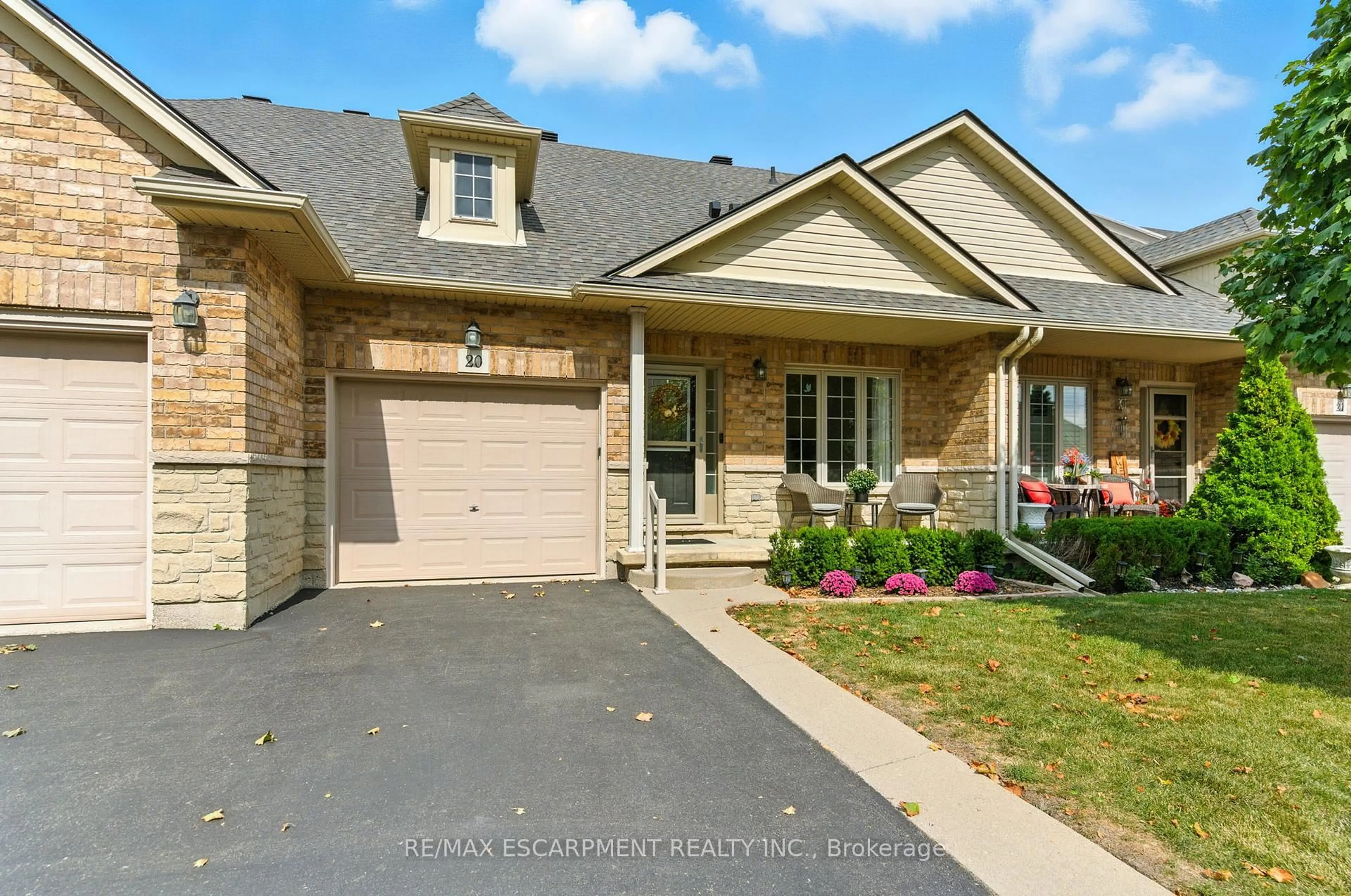 Home with brick exterior material, street for 310 Southbrook Dr #20, Hamilton Ontario L0R 1C0