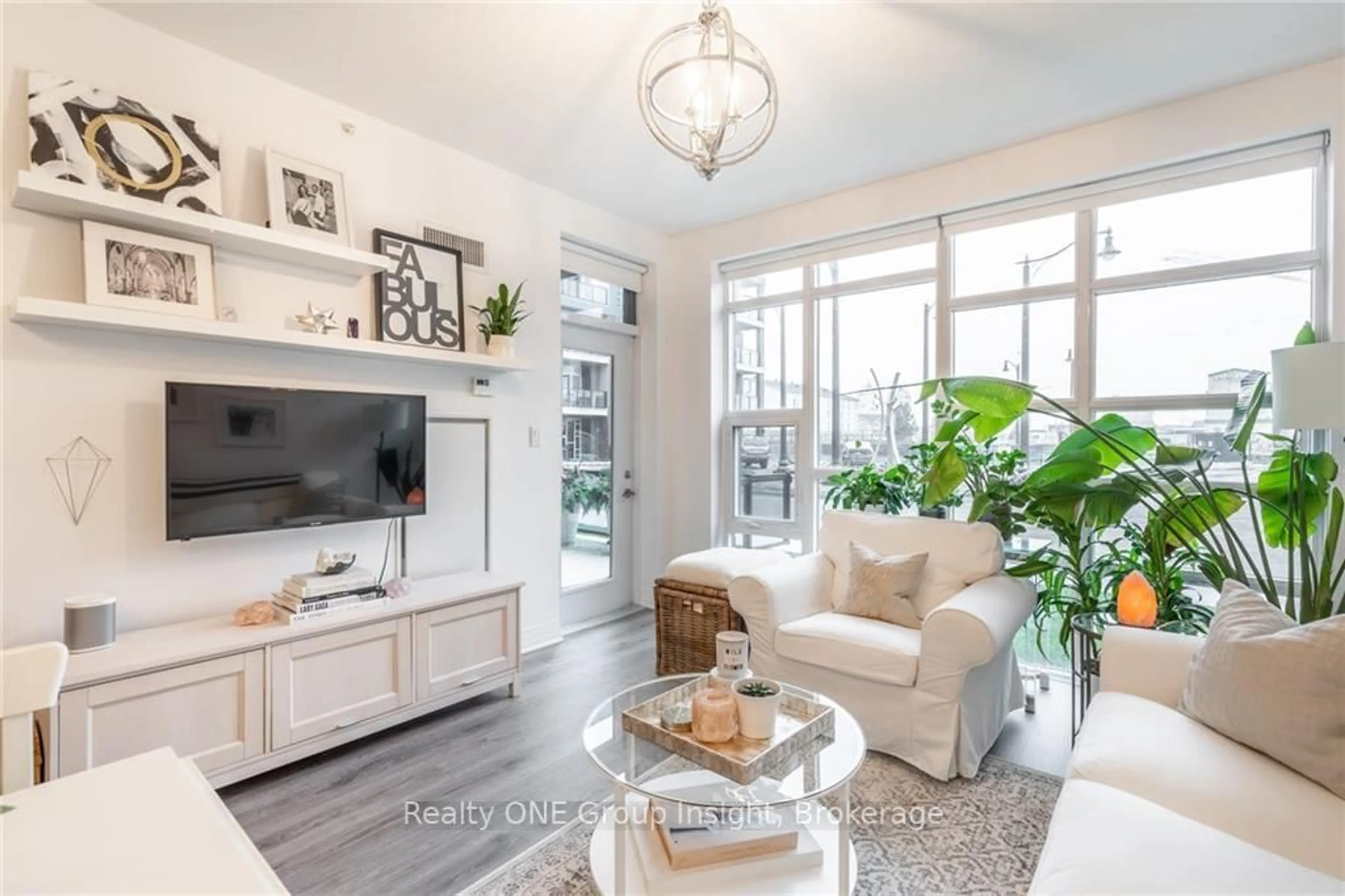 Living room with furniture, unknown for 10 Concord Pl #102, Grimsby Ontario L3M 0G6