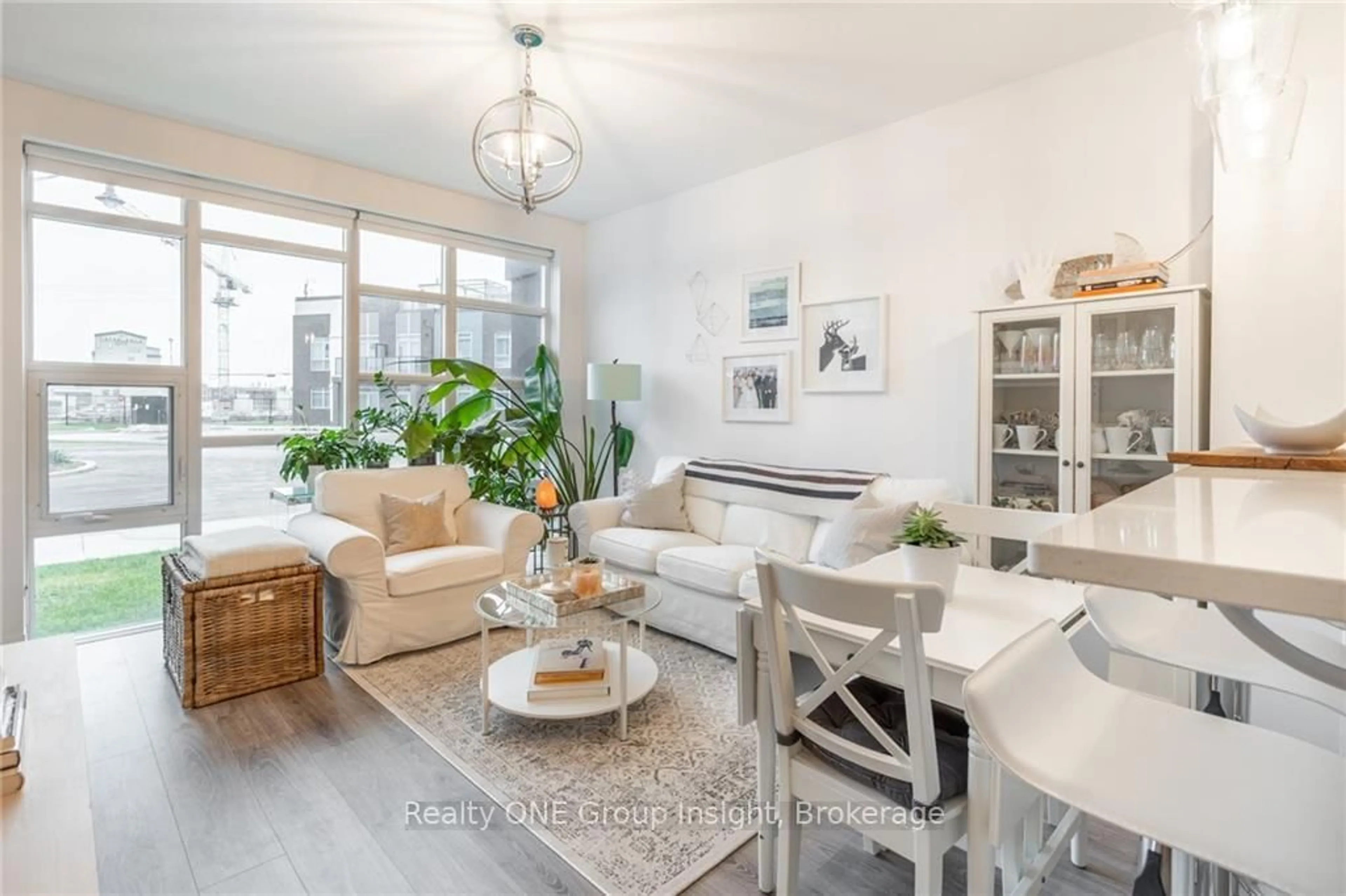 Living room with furniture, unknown for 10 Concord Pl #102, Grimsby Ontario L3M 0G6