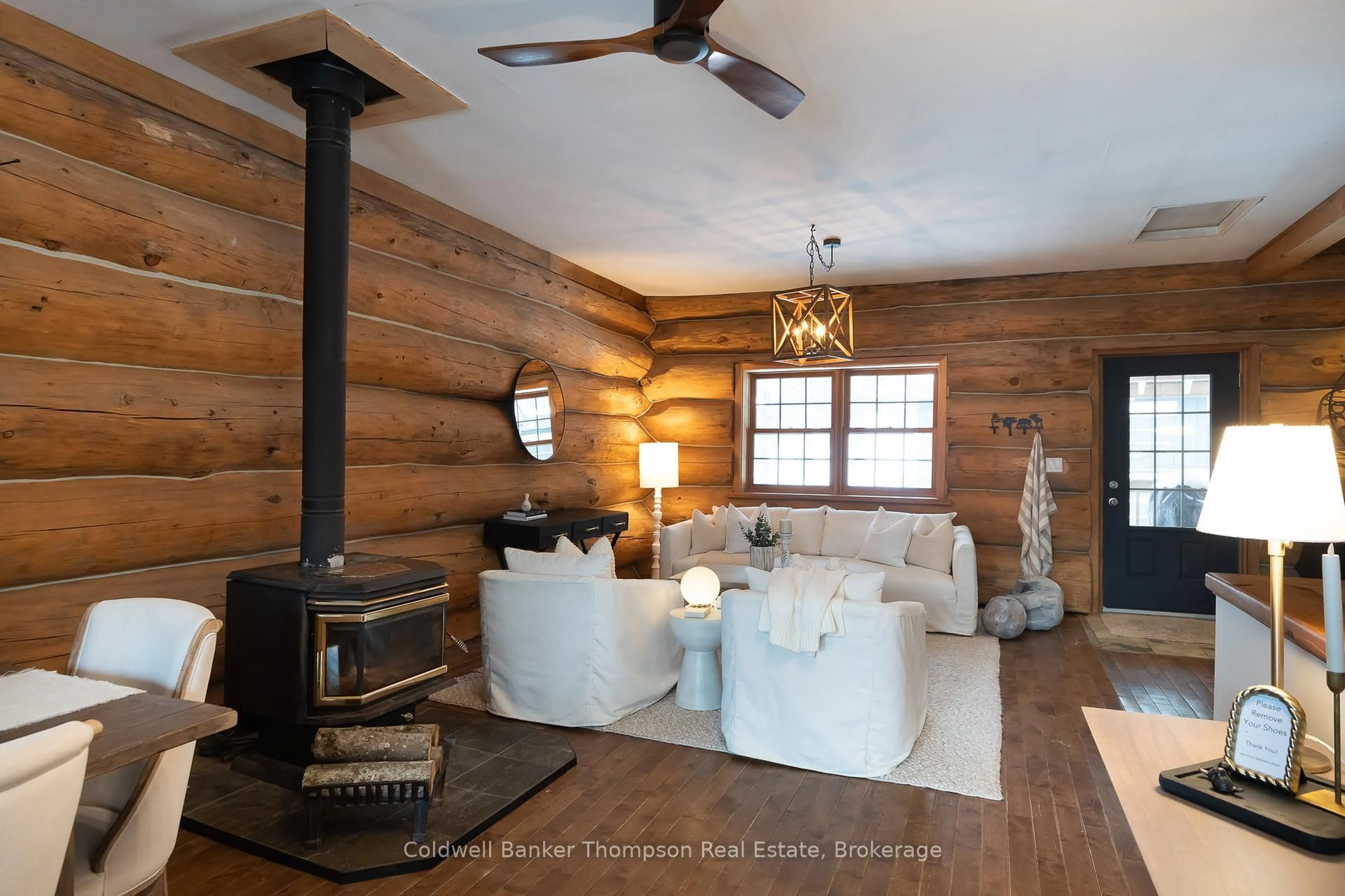 Living room with furniture, wood/laminate floor for 299 Rowanwood Rd, Huntsville Ontario P0B 1M0
