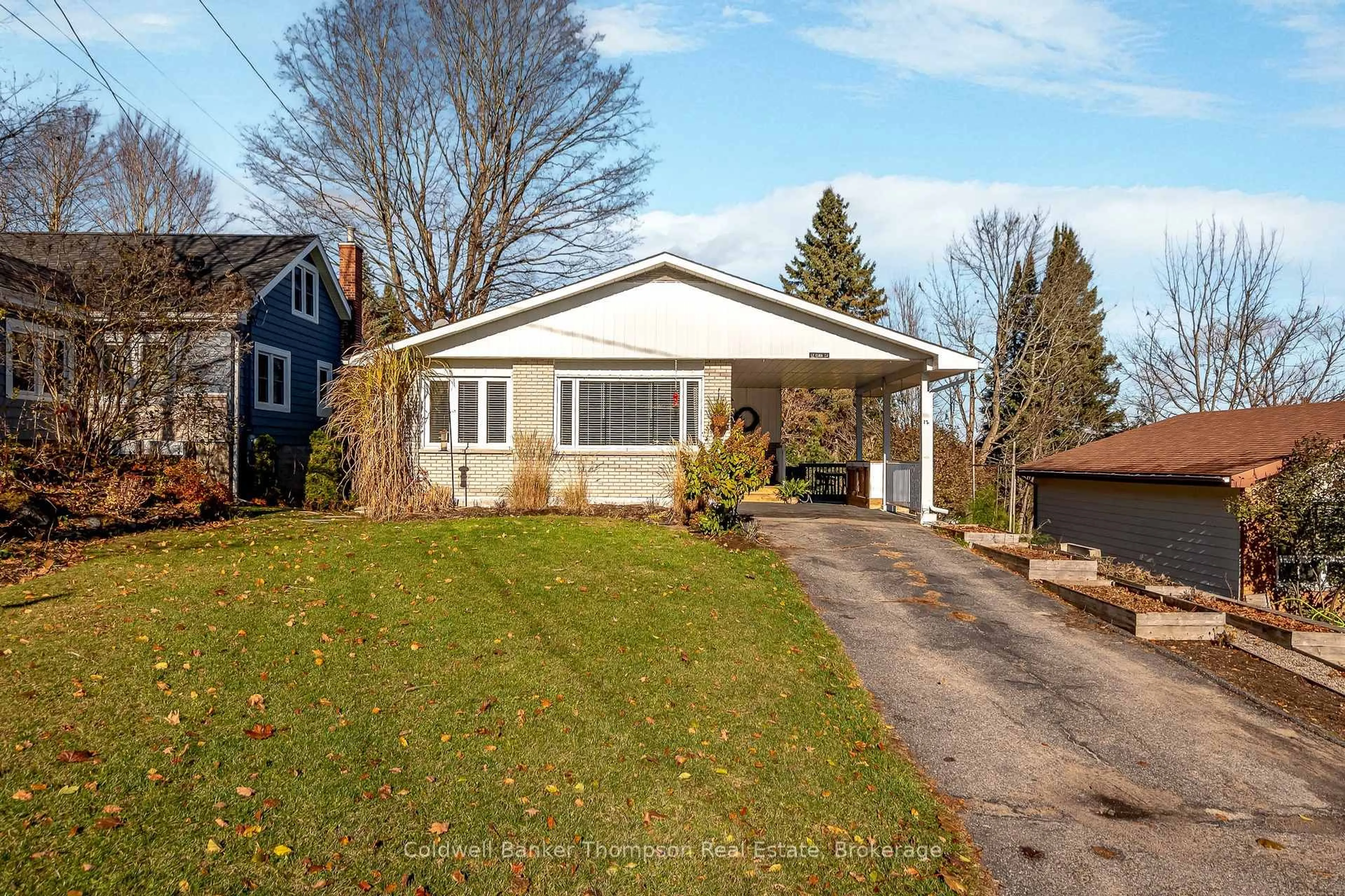 A pic from outside/outdoor area/front of a property/back of a property/a pic from drone, street for 12 Cora St, Huntsville Ontario P1H 1V7