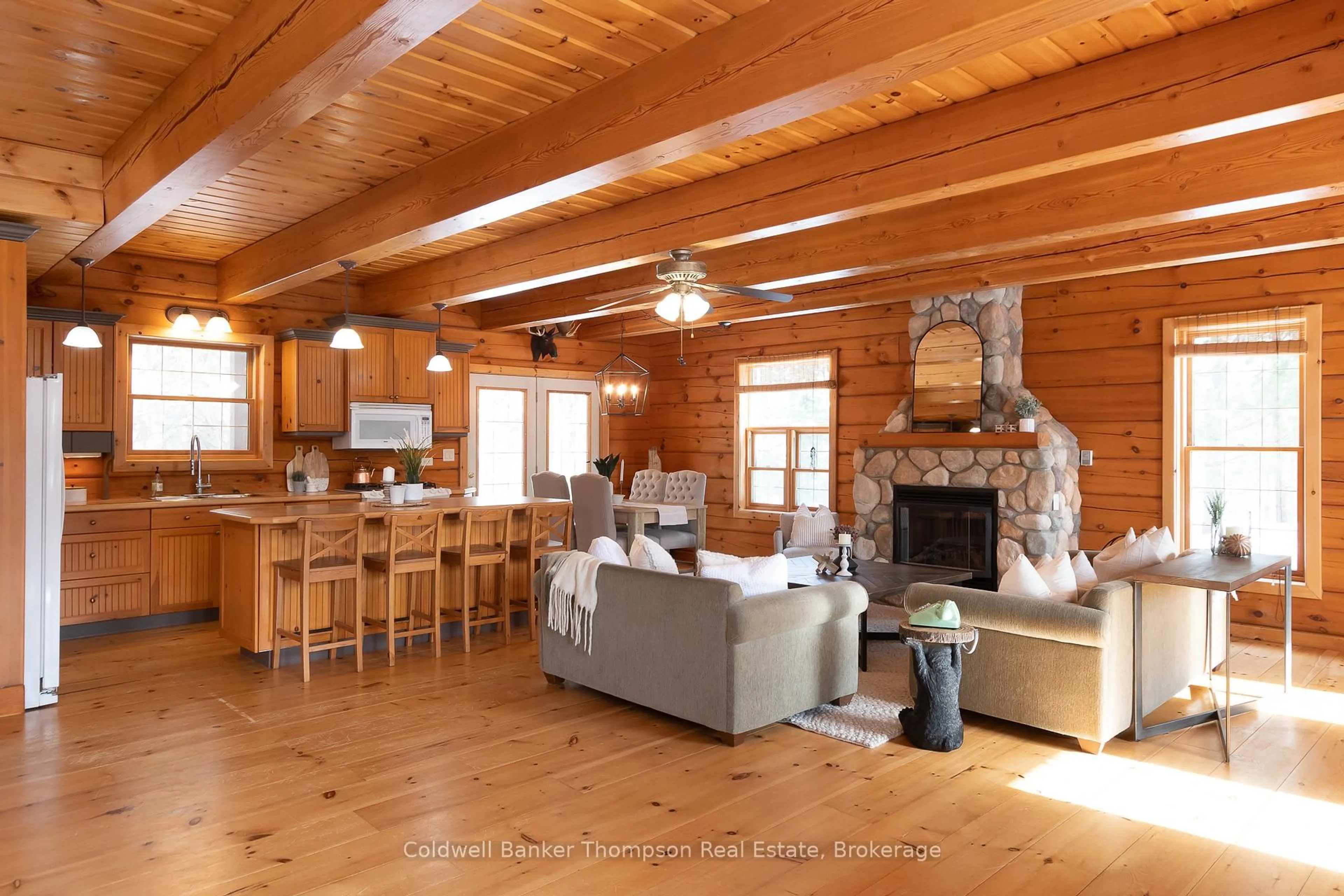 Living room with furniture, wood/laminate floor for 48 Shellwood Shores Ave, Huntsville Ontario P1H 2M4
