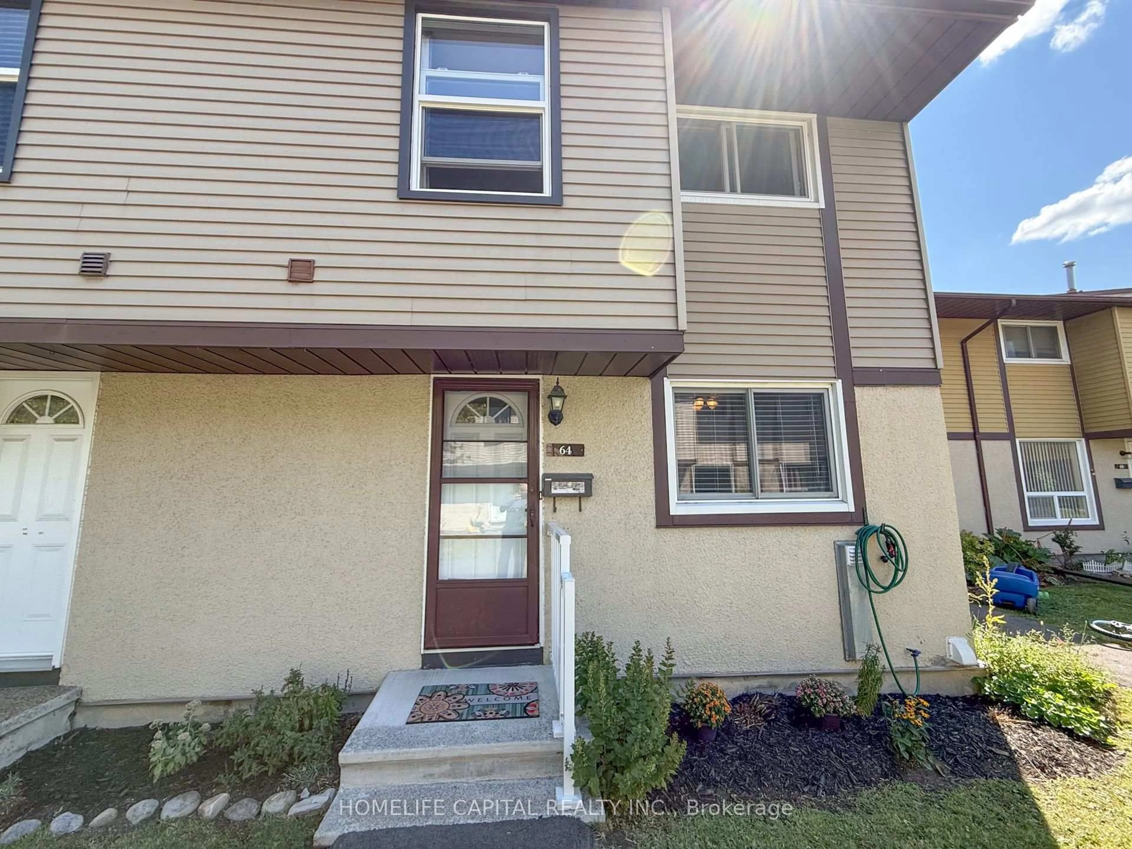 Home with vinyl exterior material, street for 2570 Southvale Cres #64, Ottawa Ontario K1B 5B7