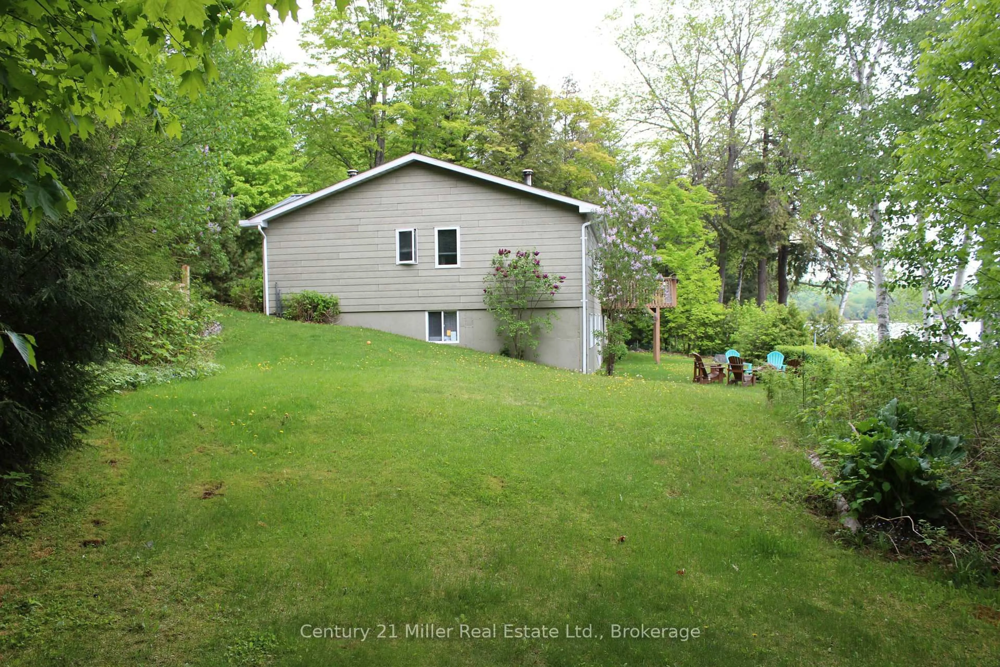 A pic from outside/outdoor area/front of a property/back of a property/a pic from drone, water/lake/river/ocean view for 994 Kamaniskeg Lake Rd, Combermere Ontario K0J 1L0