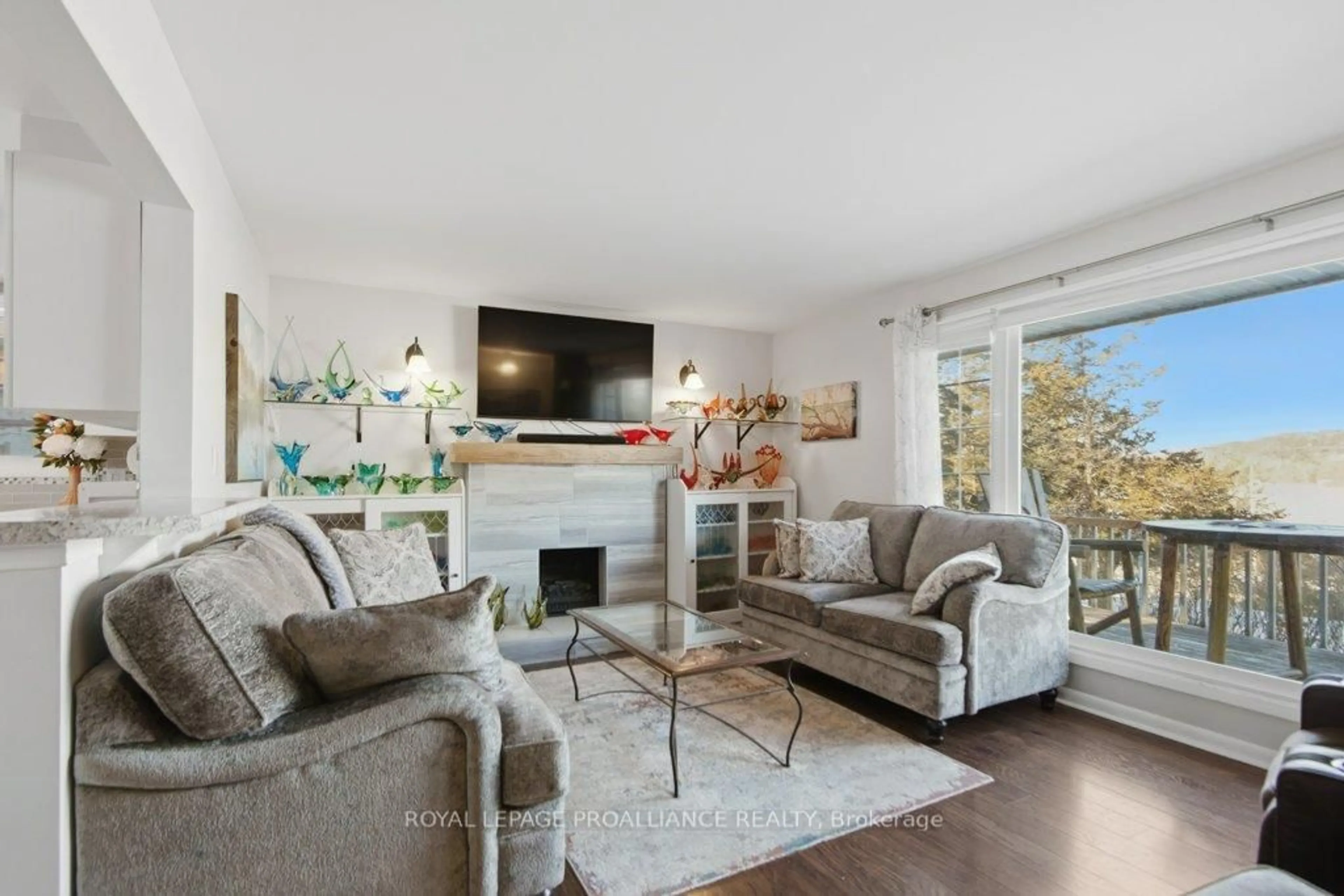 Living room with furniture, wood/laminate floor for 550 Frankford Stirling Rd, Hastings Ontario K0K 2C0