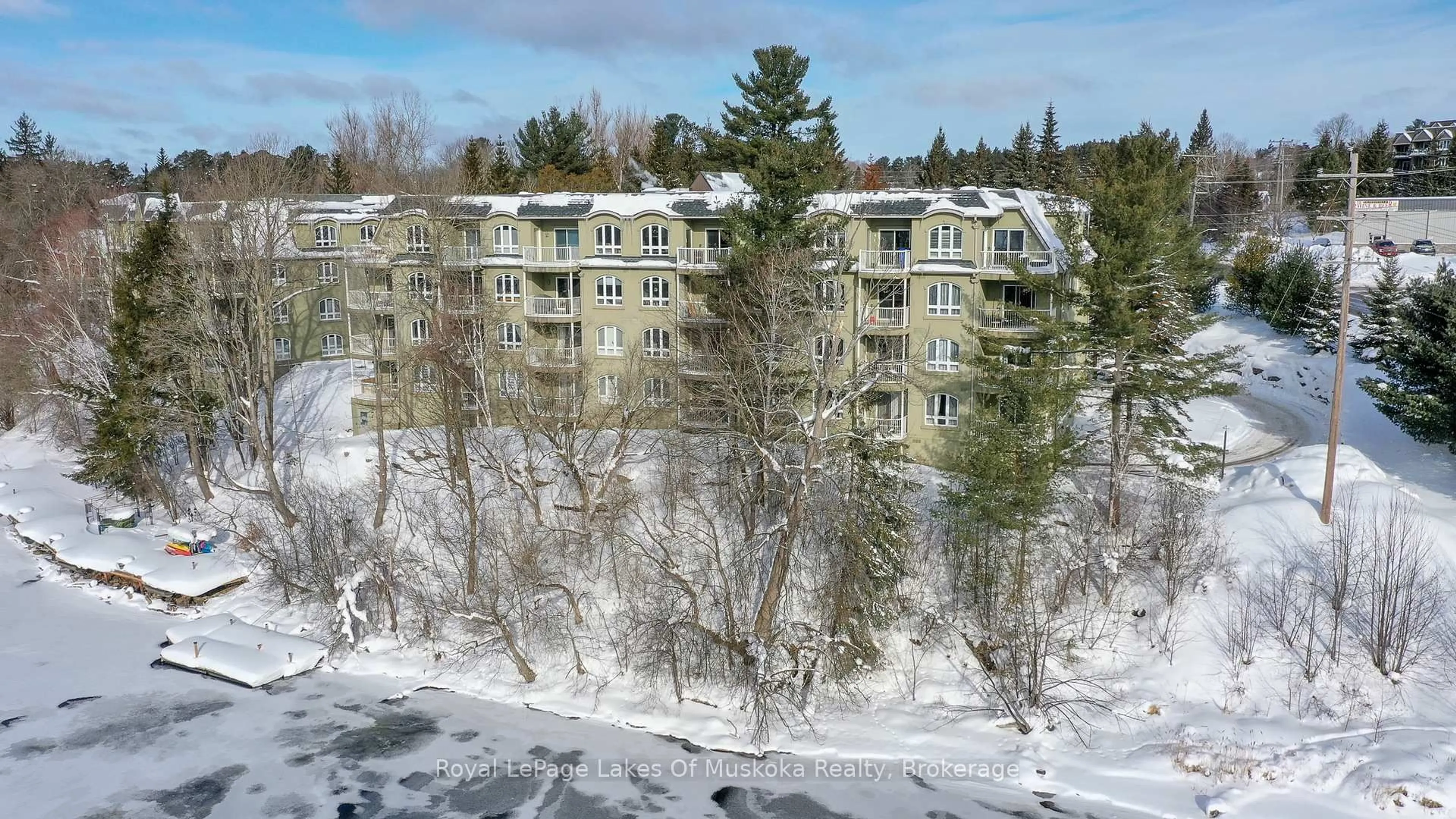 A pic from outside/outdoor area/front of a property/back of a property/a pic from drone, unknown for 31 Dairy Lane #207, Huntsville Ontario P1H 2L7