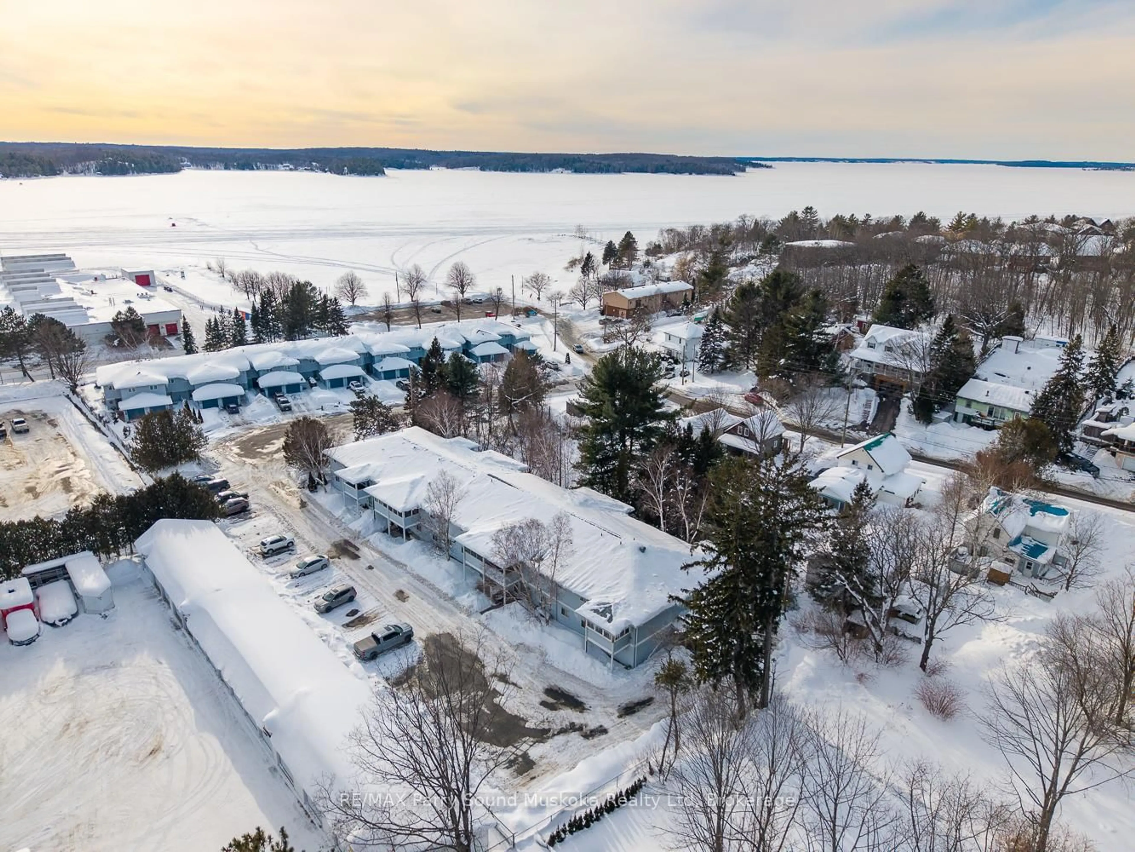 A pic from outside/outdoor area/front of a property/back of a property/a pic from drone, water/lake/river/ocean view for 1 Georgian Bay Ave #12, Parry Sound Ontario P2A 3B1