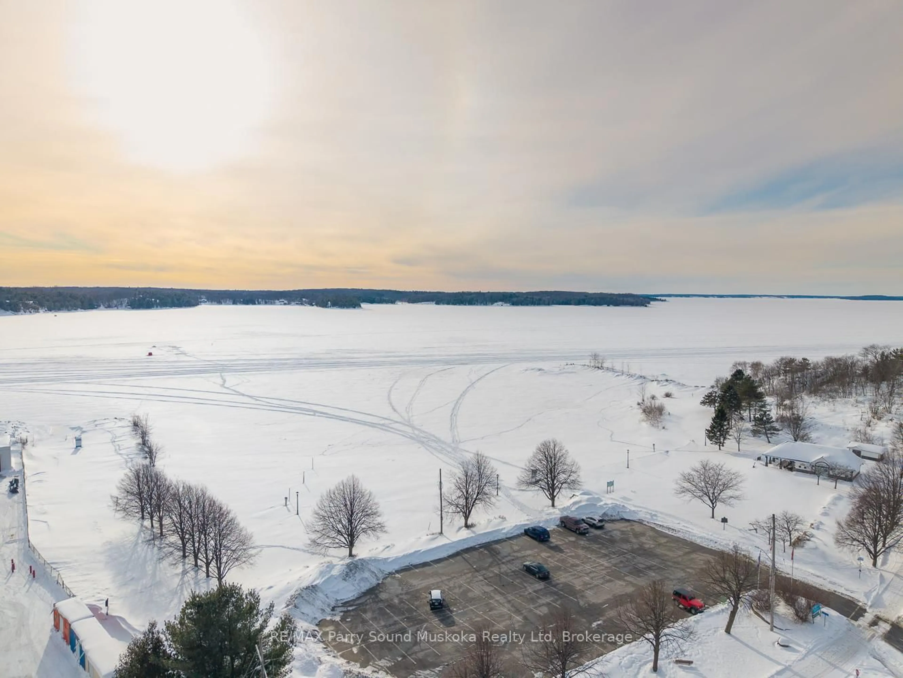 A pic from outside/outdoor area/front of a property/back of a property/a pic from drone, water/lake/river/ocean view for 1 Georgian Bay Ave #12, Parry Sound Ontario P2A 3B1