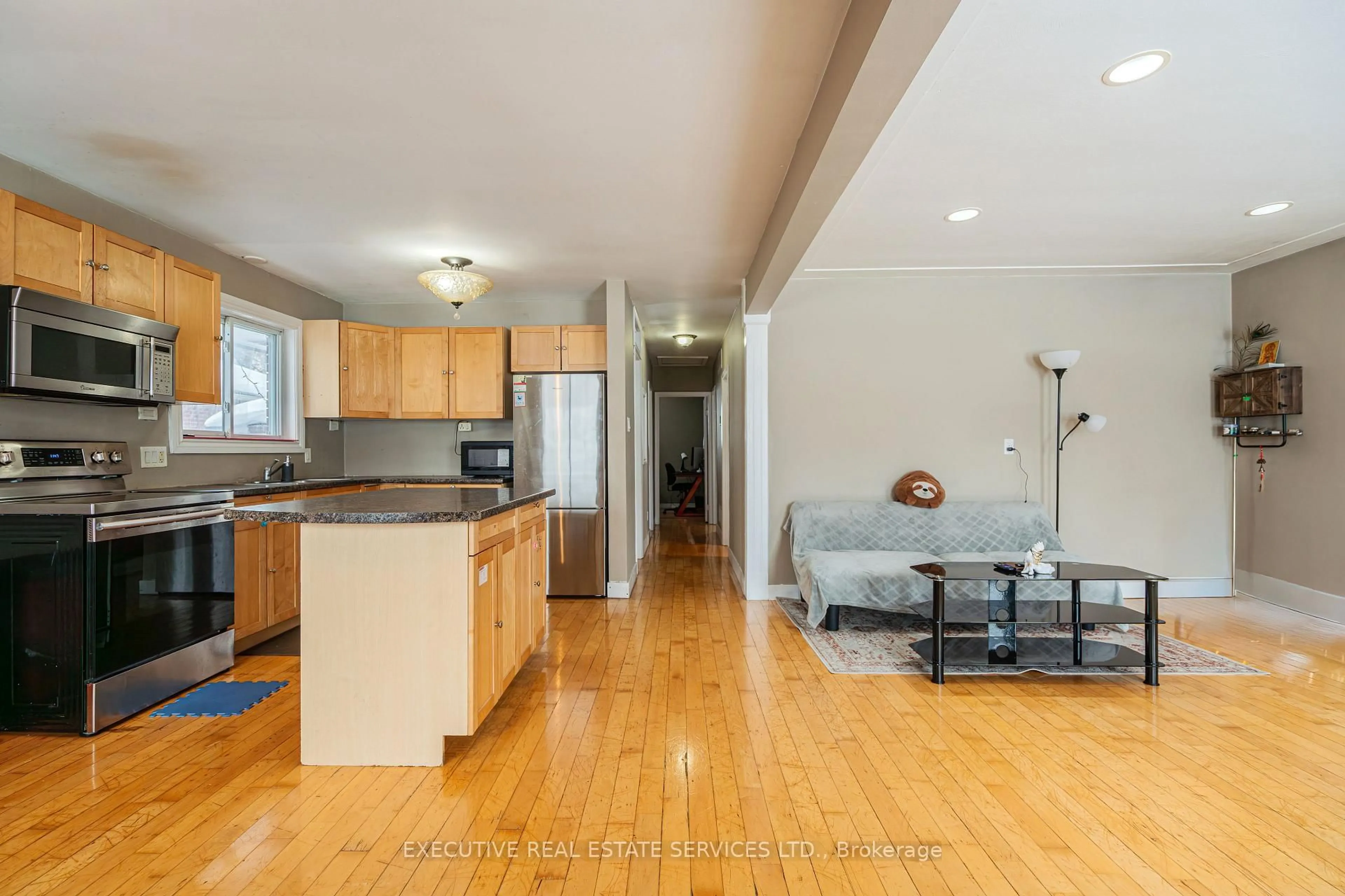 Open concept kitchen, wood/laminate floor for 268 Ross Ave, Kitchener Ontario N2A 1V6