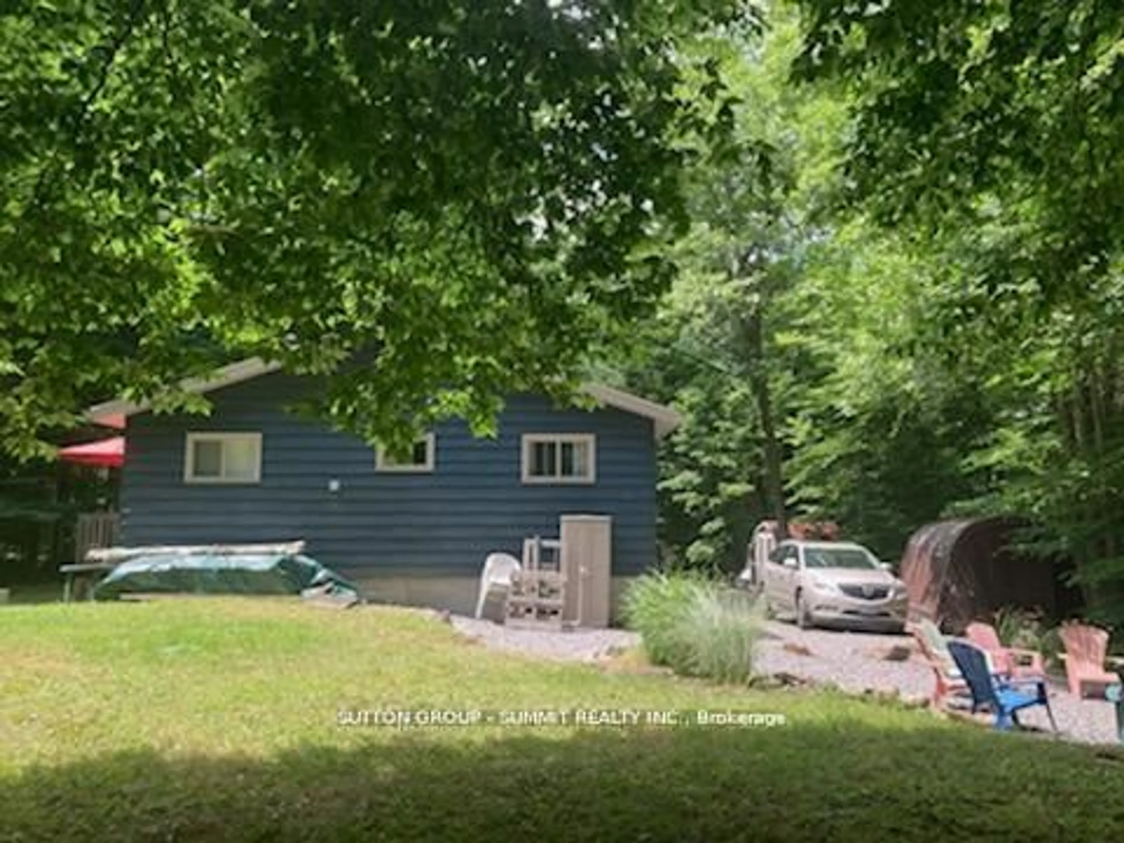 A pic from outside/outdoor area/front of a property/back of a property/a pic from drone, forest/trees view for 119 HOOD Rd, Huntsville Ontario P1H 2J3