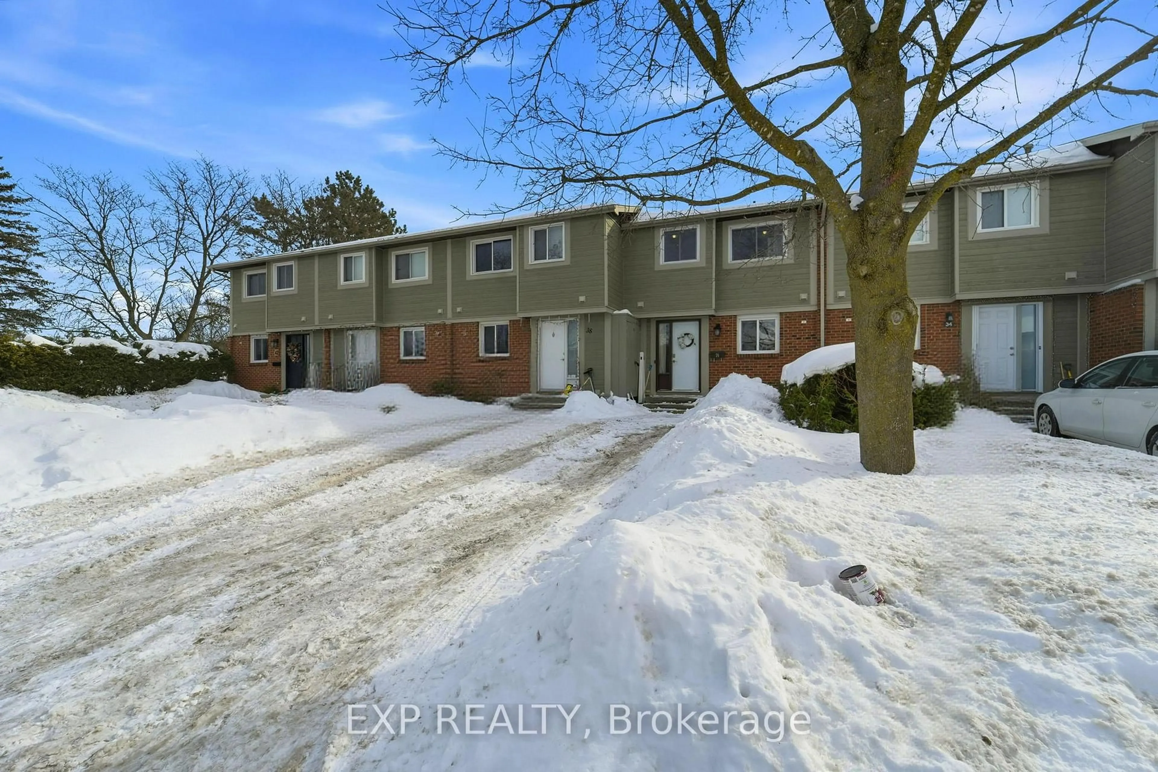 A pic from outside/outdoor area/front of a property/back of a property/a pic from drone, street for 36 Barrow Cres #78, Ottawa Ontario K2L 2K1