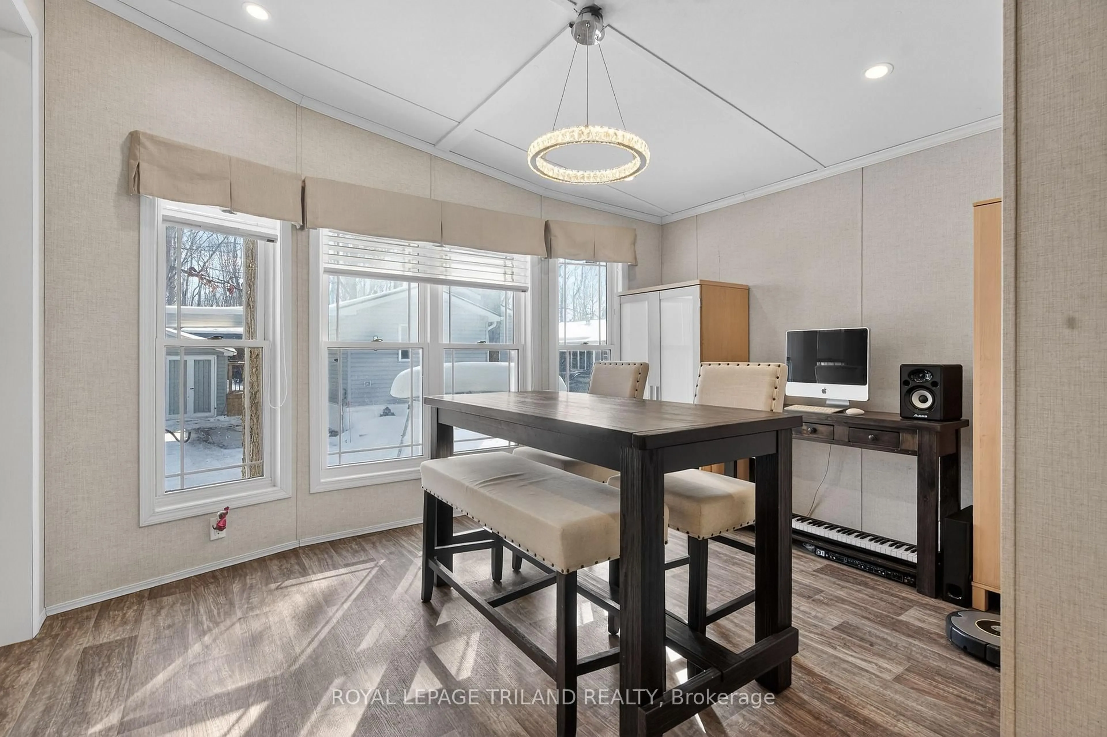 Open concept kitchen, wood/laminate floor for 22790 Amiens Rd #56, Middlesex Centre Ontario N0L 1R0