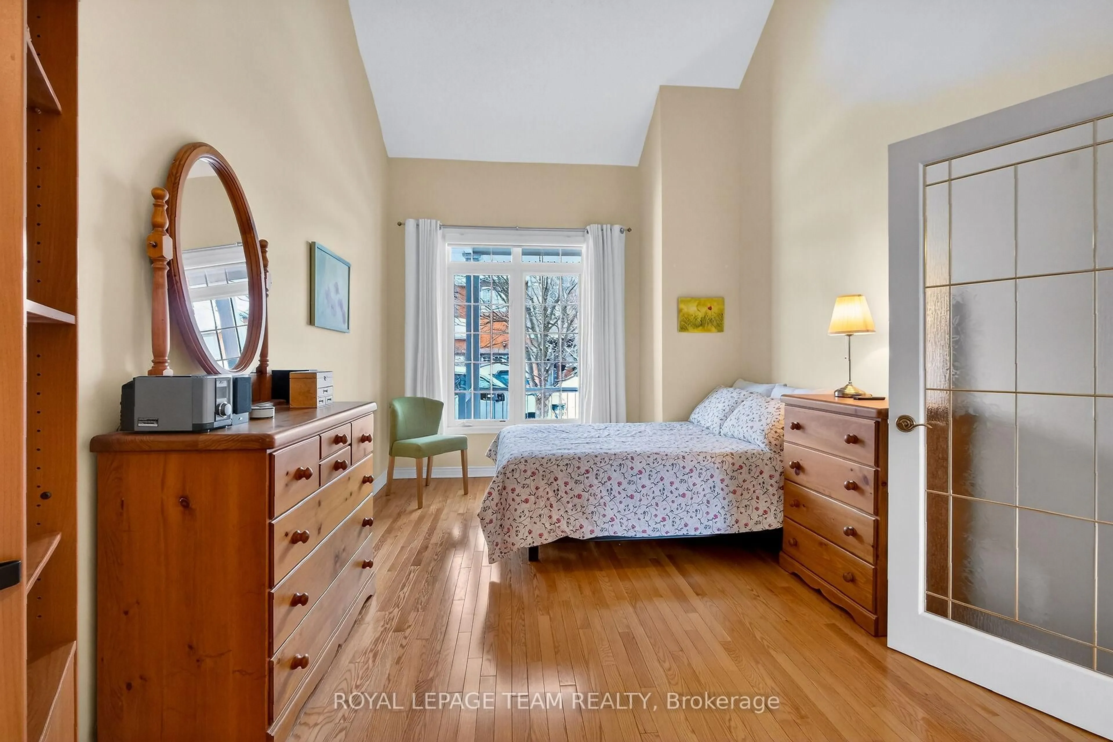 Bedroom with bed, wood/laminate floor for 52 Great Oak Private, Ottawa Ontario K1G 6P8