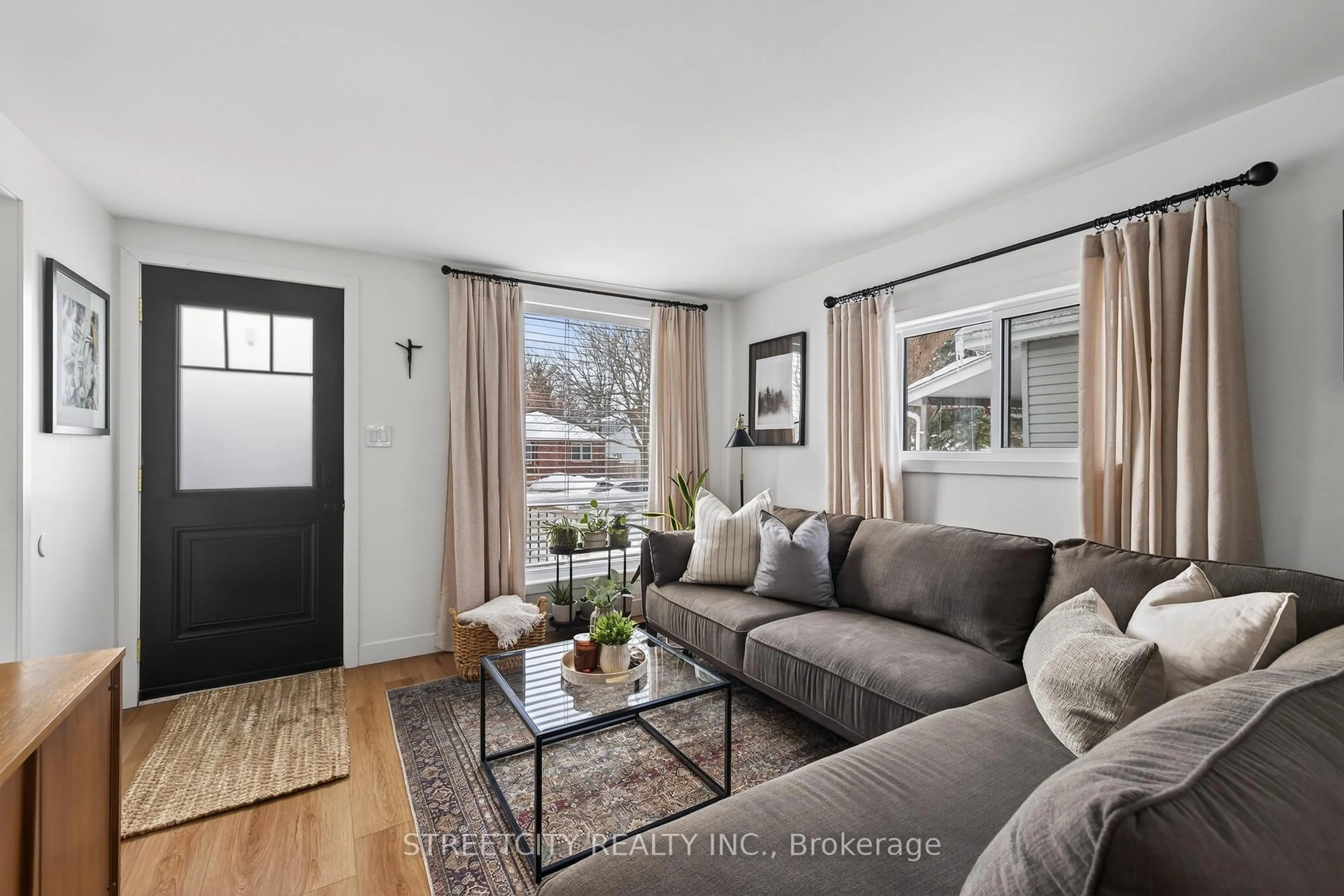 Living room with furniture, wood/laminate floor for 36 Langarth St, London South Ontario N6J 1P2