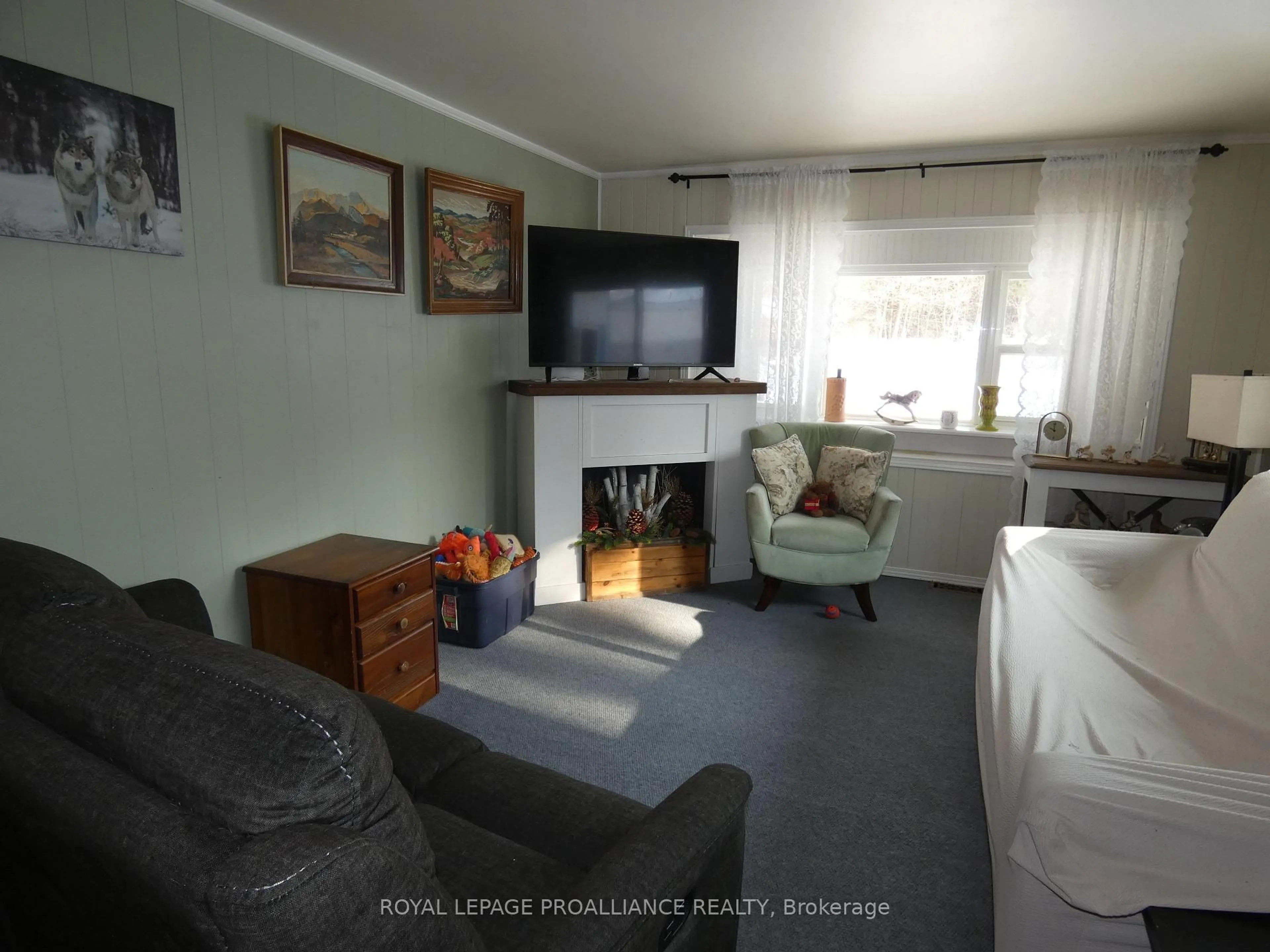 Living room with furniture, wood/laminate floor for 1645 County Road 42 Rd #21, Rideau Lakes Ontario K0G 1E0