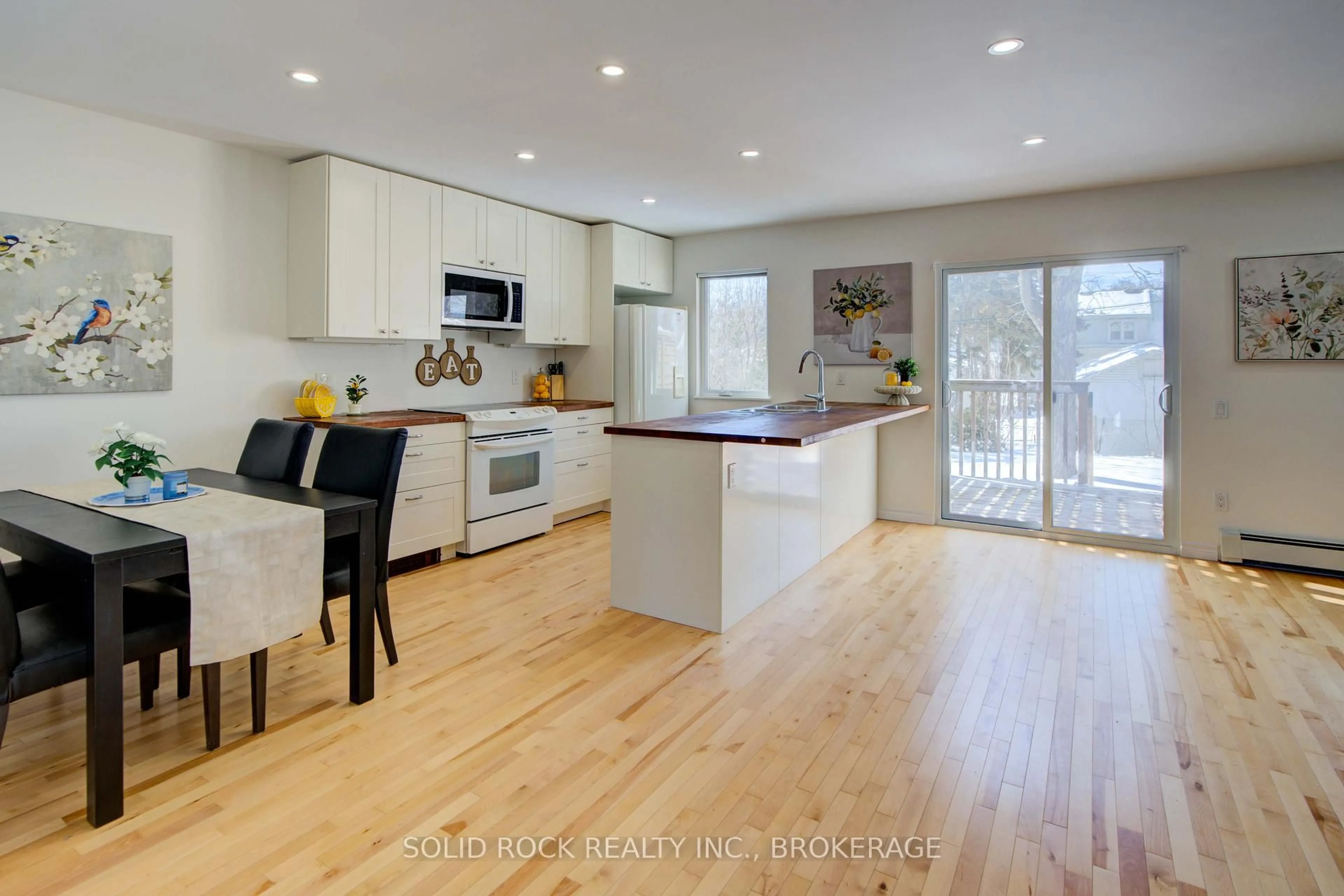 Open concept kitchen, wood/laminate floor for 30 Fergus St, Kingston Ontario K7K 4K9