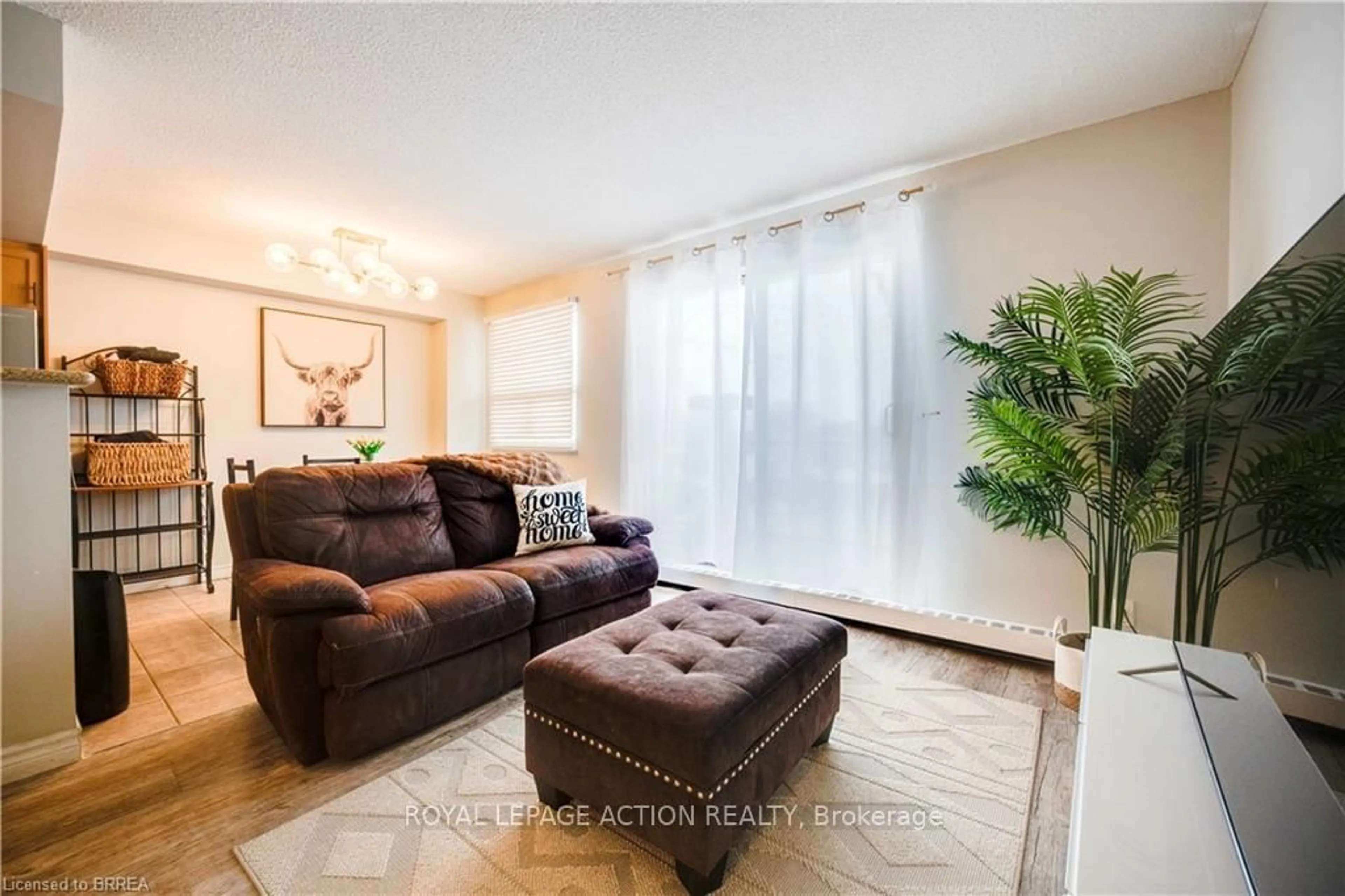 Living room with furniture, unknown for 793 Colborne St #304, Brantford Ontario N3S 7J3