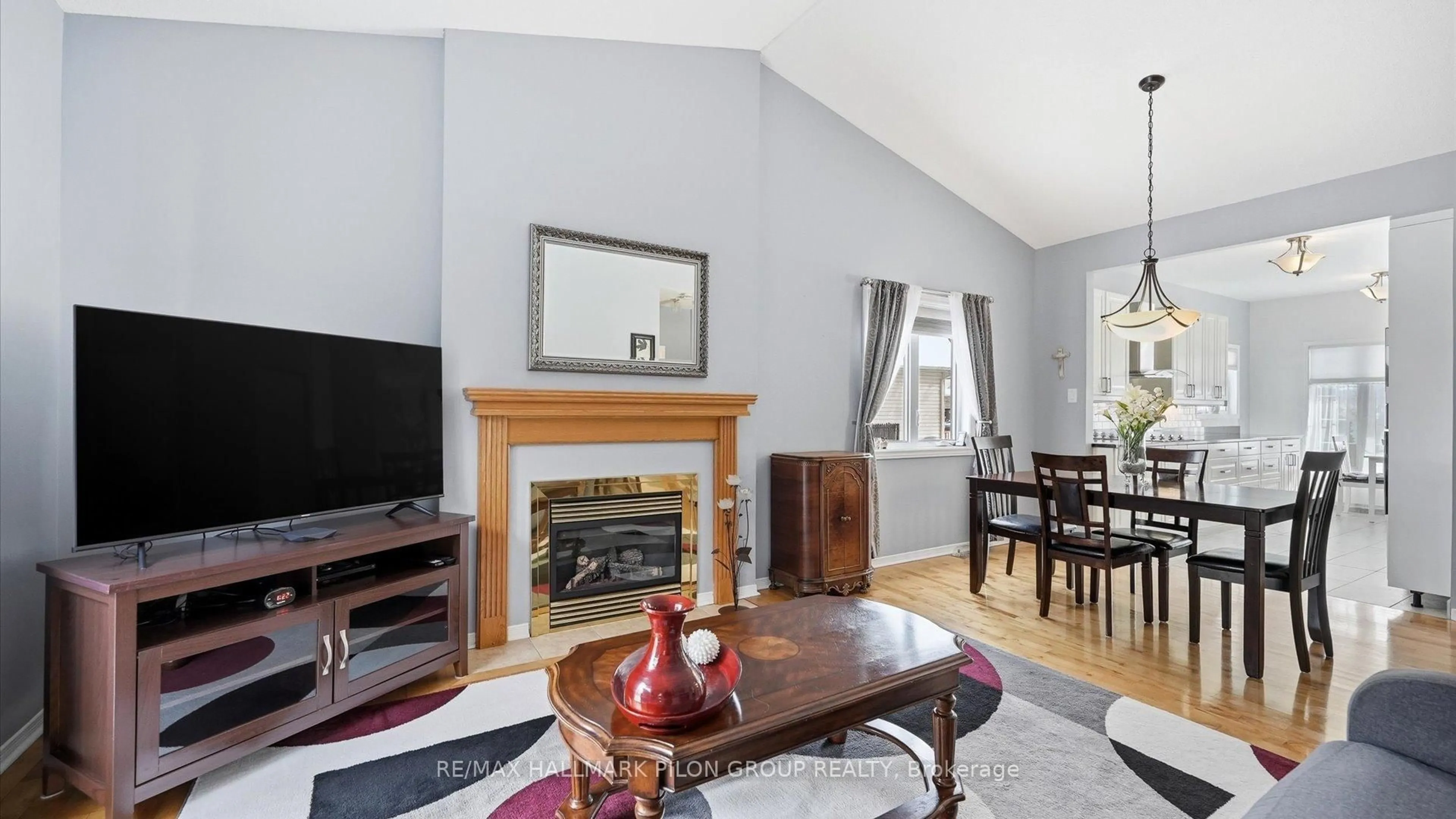 Living room with furniture, wood/laminate floor for 303 Rustic Hills Cres, Orleans Ontario K4A 5A5