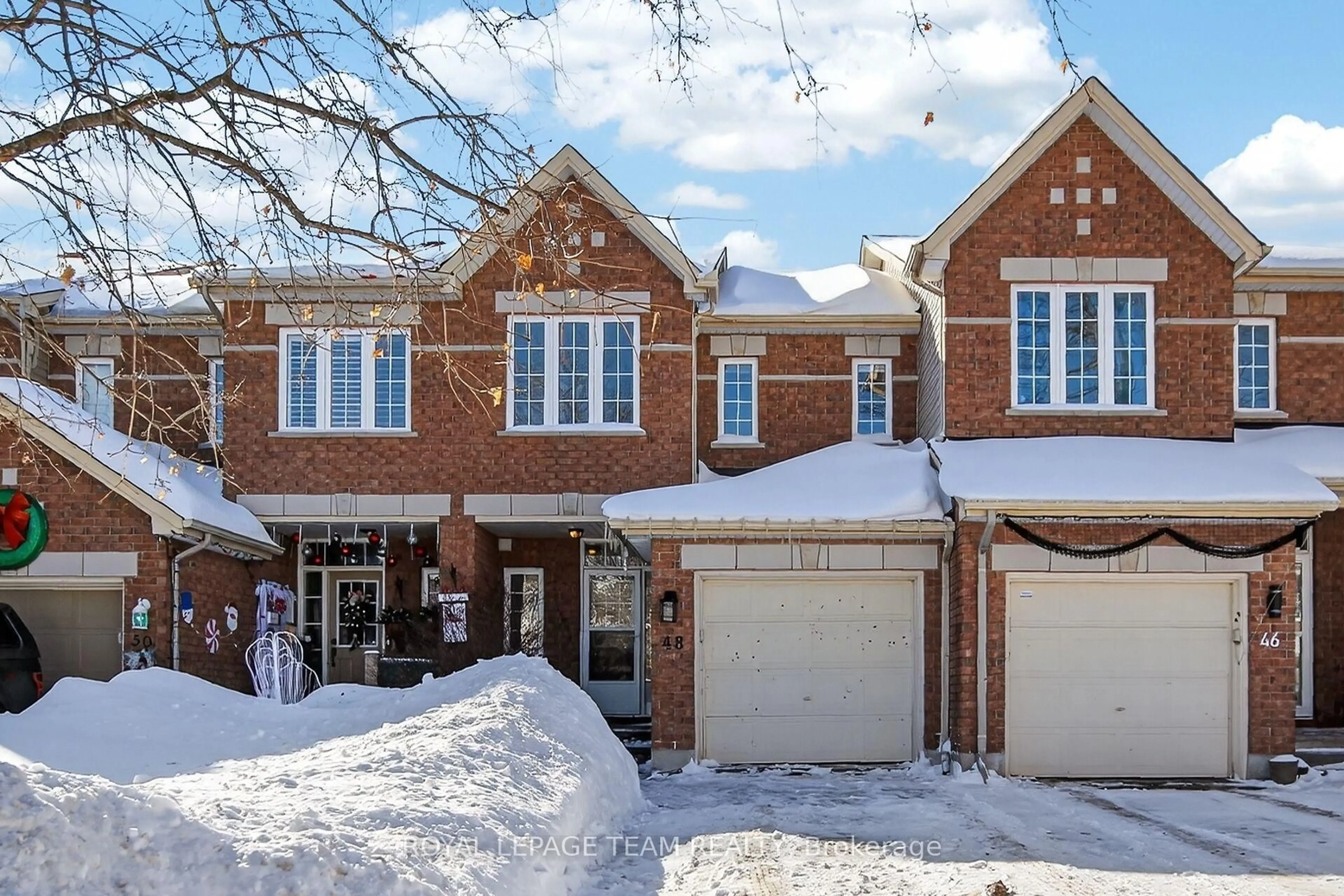 Home with brick exterior material, street for 48 Saddlesmith Circ, Ottawa Ontario K2M 2Y9