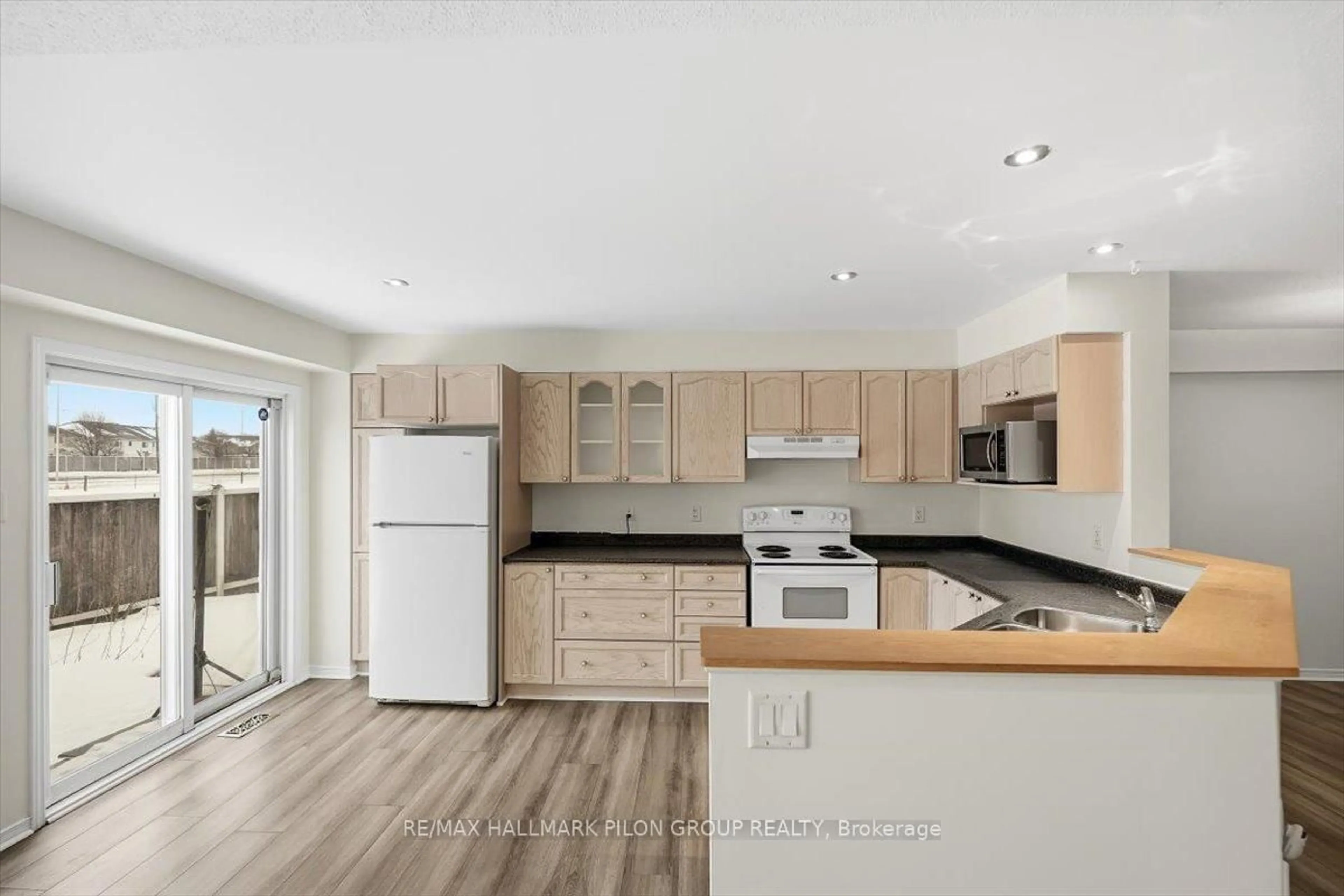 Open concept kitchen, wood/laminate floor for 2015 Breezewood St, Orleans Ontario K4A 4S7