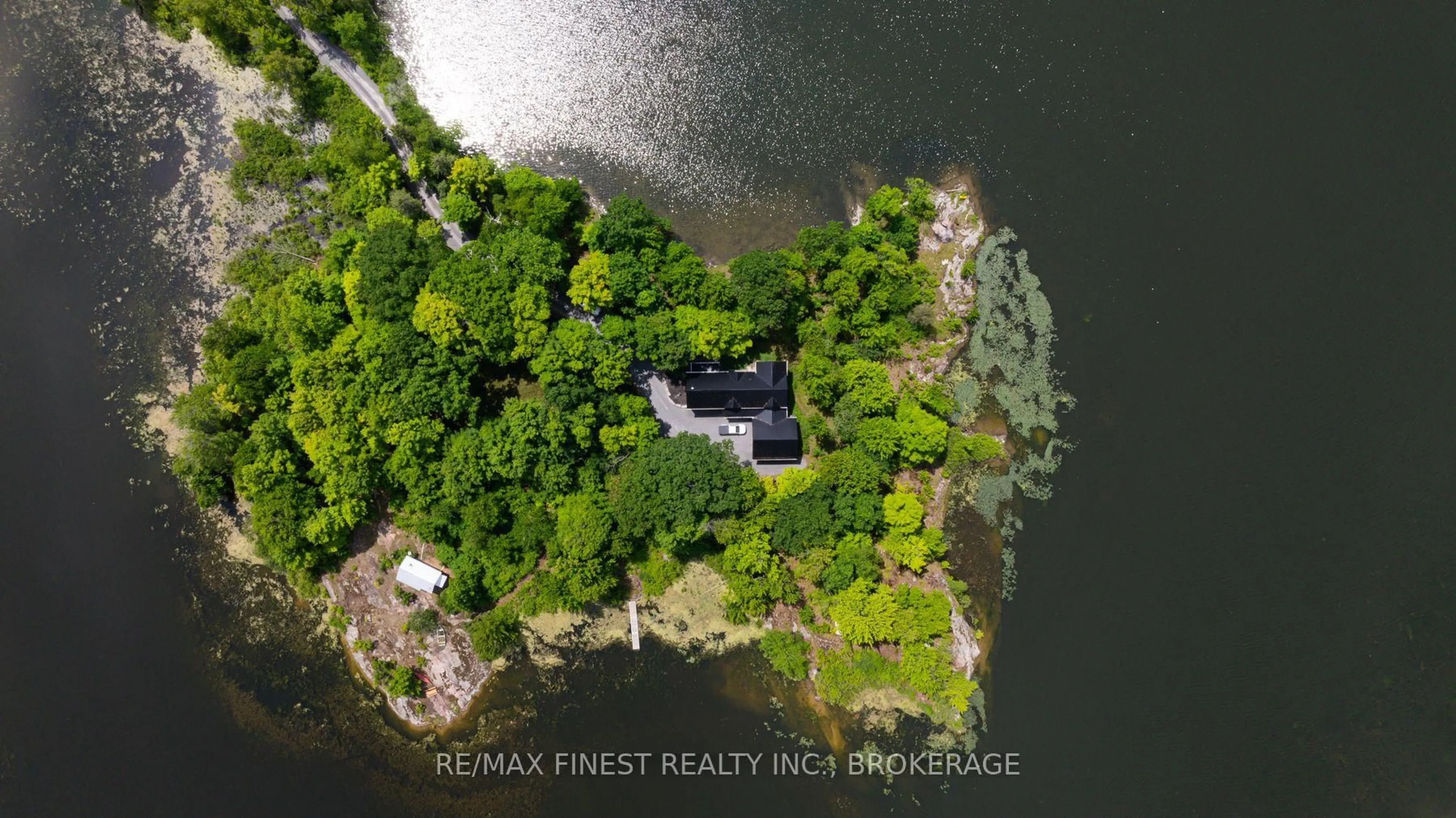 A pic from outside/outdoor area/front of a property/back of a property/a pic from drone, water/lake/river/ocean view for 3855 Hideaway Lane, Battersea Ontario K0H 1H0