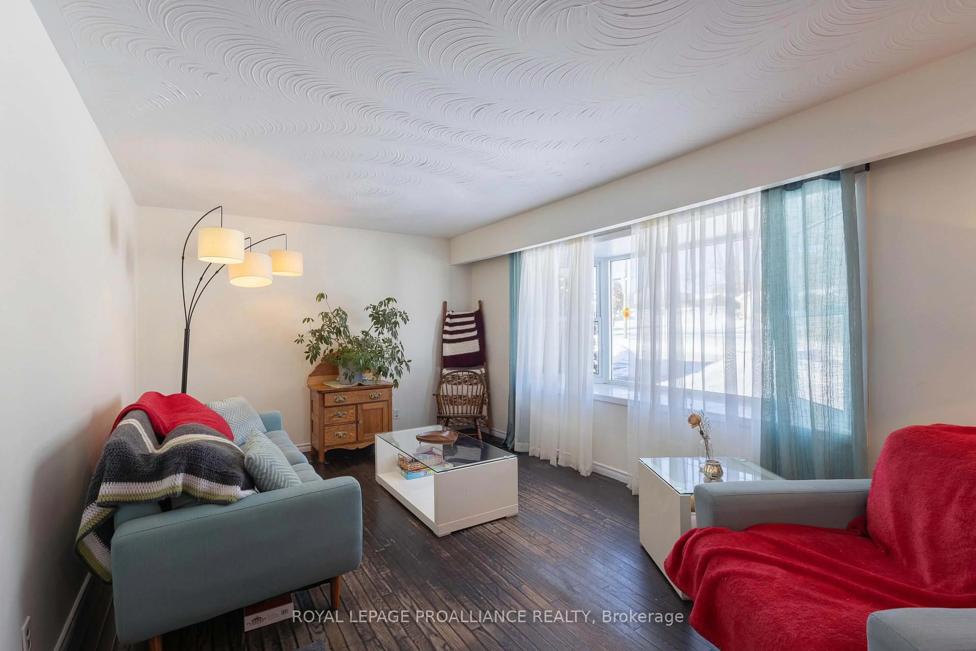 Living room with furniture, wood/laminate floor for 26 Cloverleaf Dr, Belleville Ontario K8N 4Z5