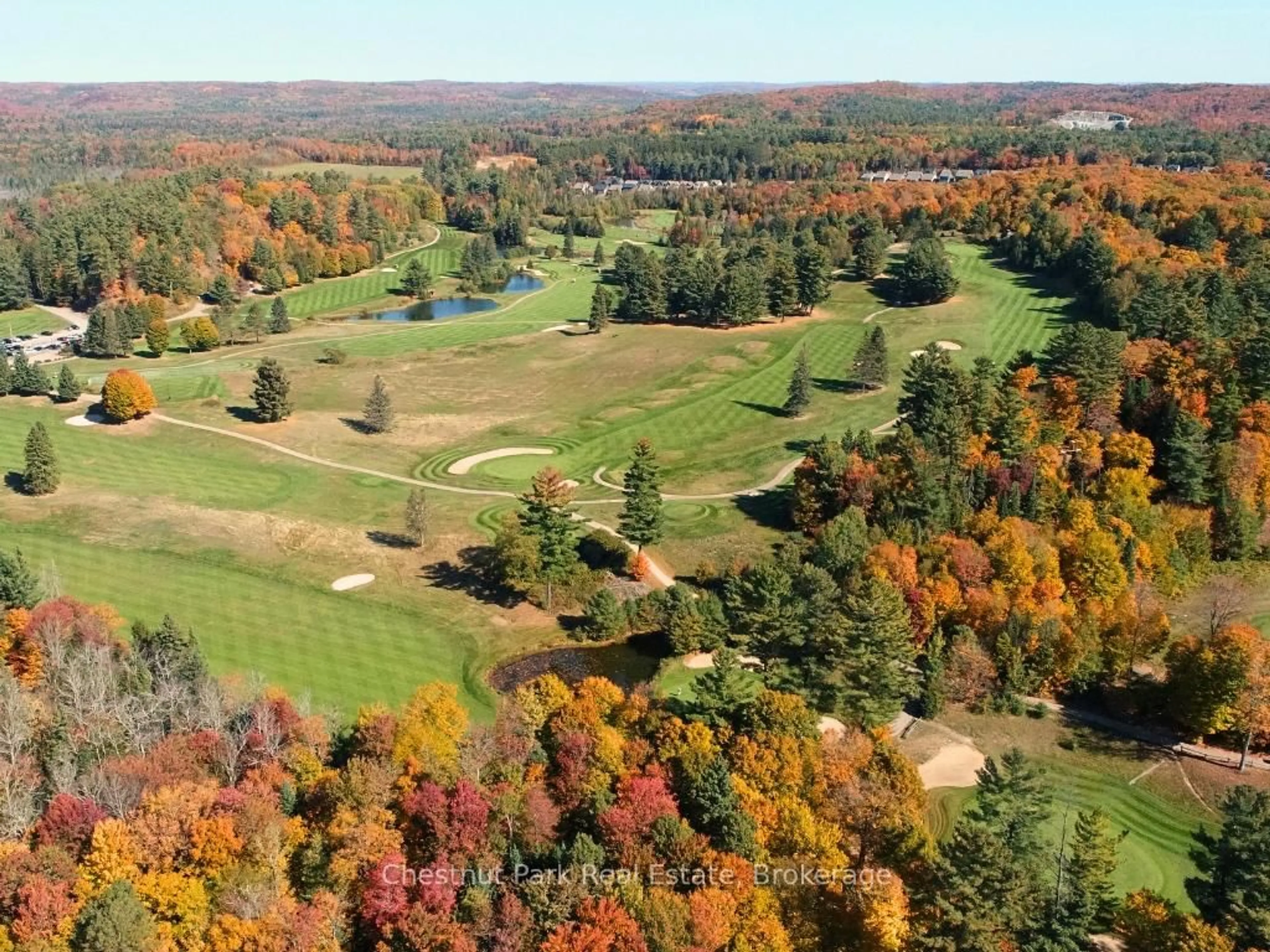 A pic from outside/outdoor area/front of a property/back of a property/a pic from drone, forest/trees view for 384 Golf Course Rd, Huntsville Ontario P1H 1N8