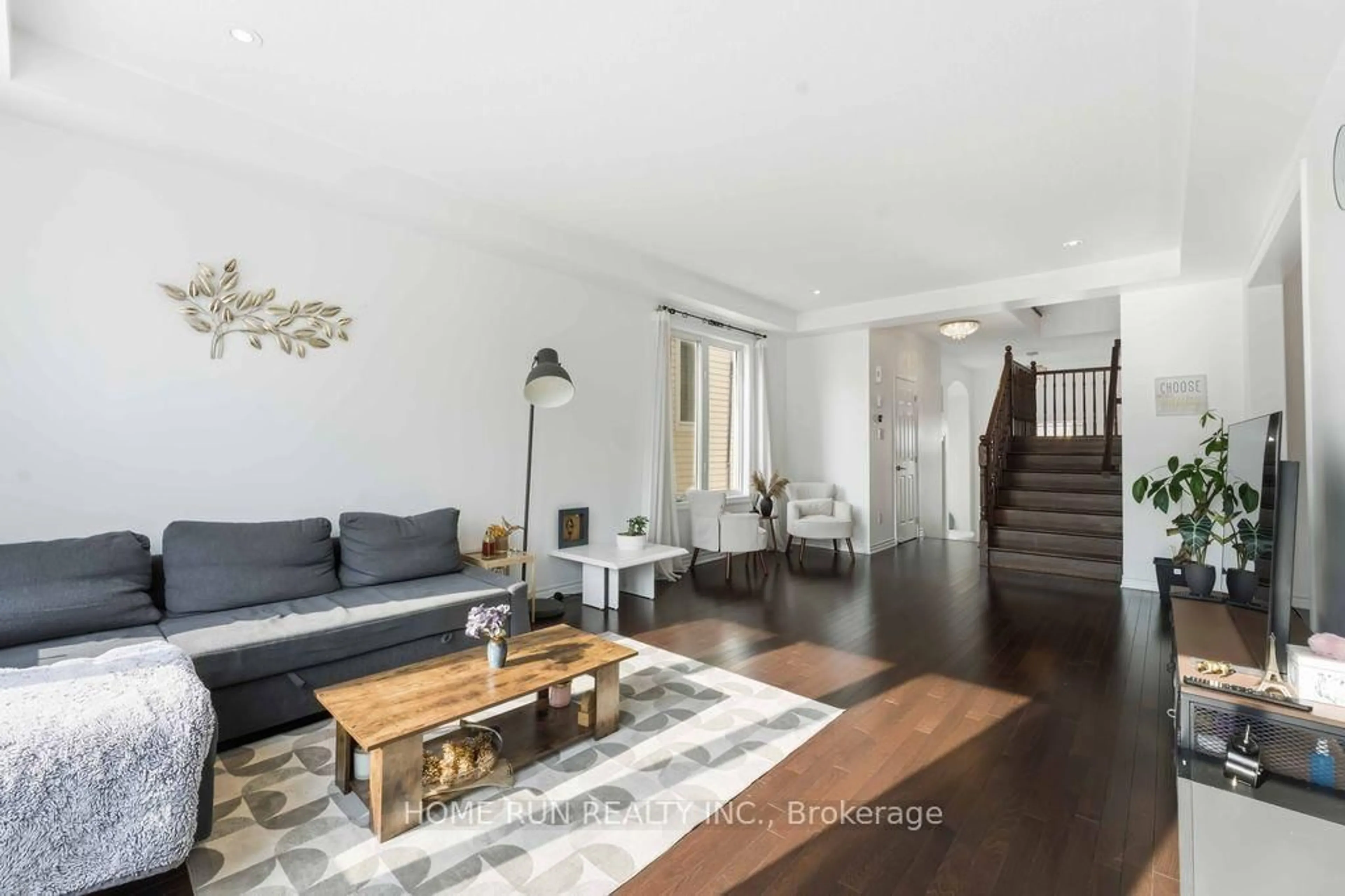 Living room with furniture, wood/laminate floor for 358 Meadowbreeze Dr, Ottawa Ontario K2M 0K3