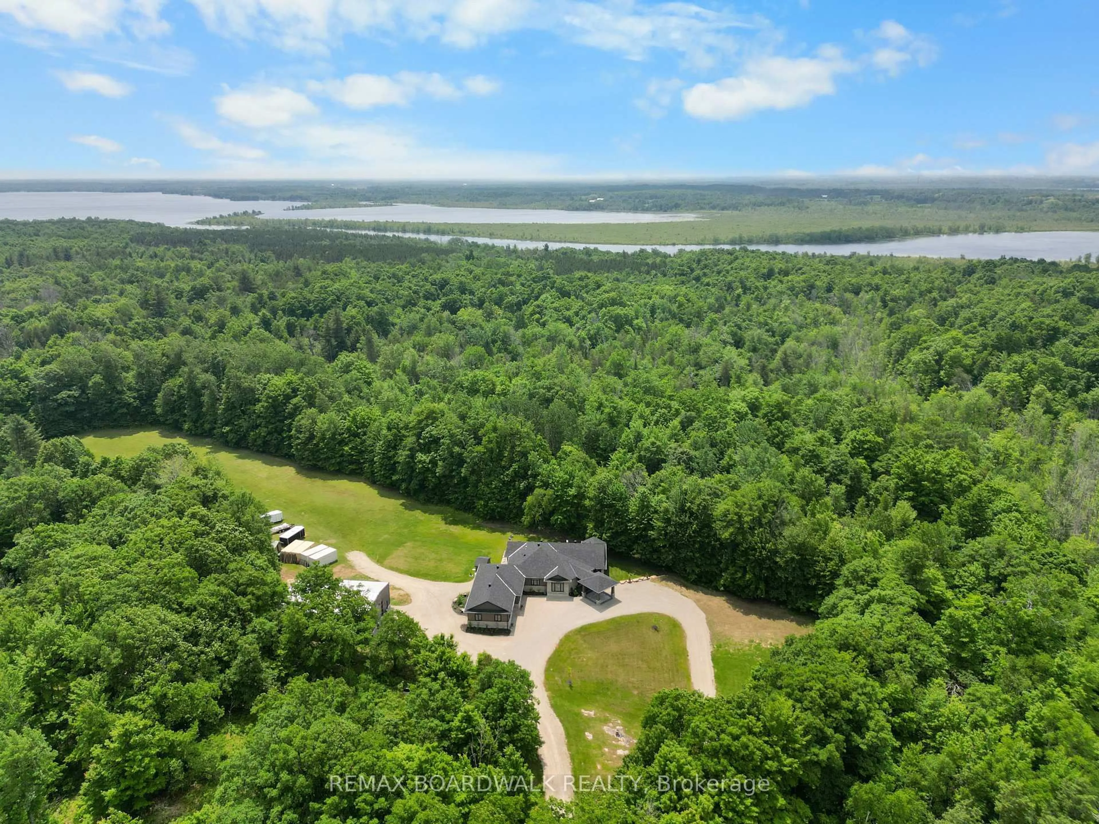 A pic from outside/outdoor area/front of a property/back of a property/a pic from drone, water/lake/river/ocean view for 1155 Ebbs Bay Rd, Carleton Place Ontario K7C 0C5