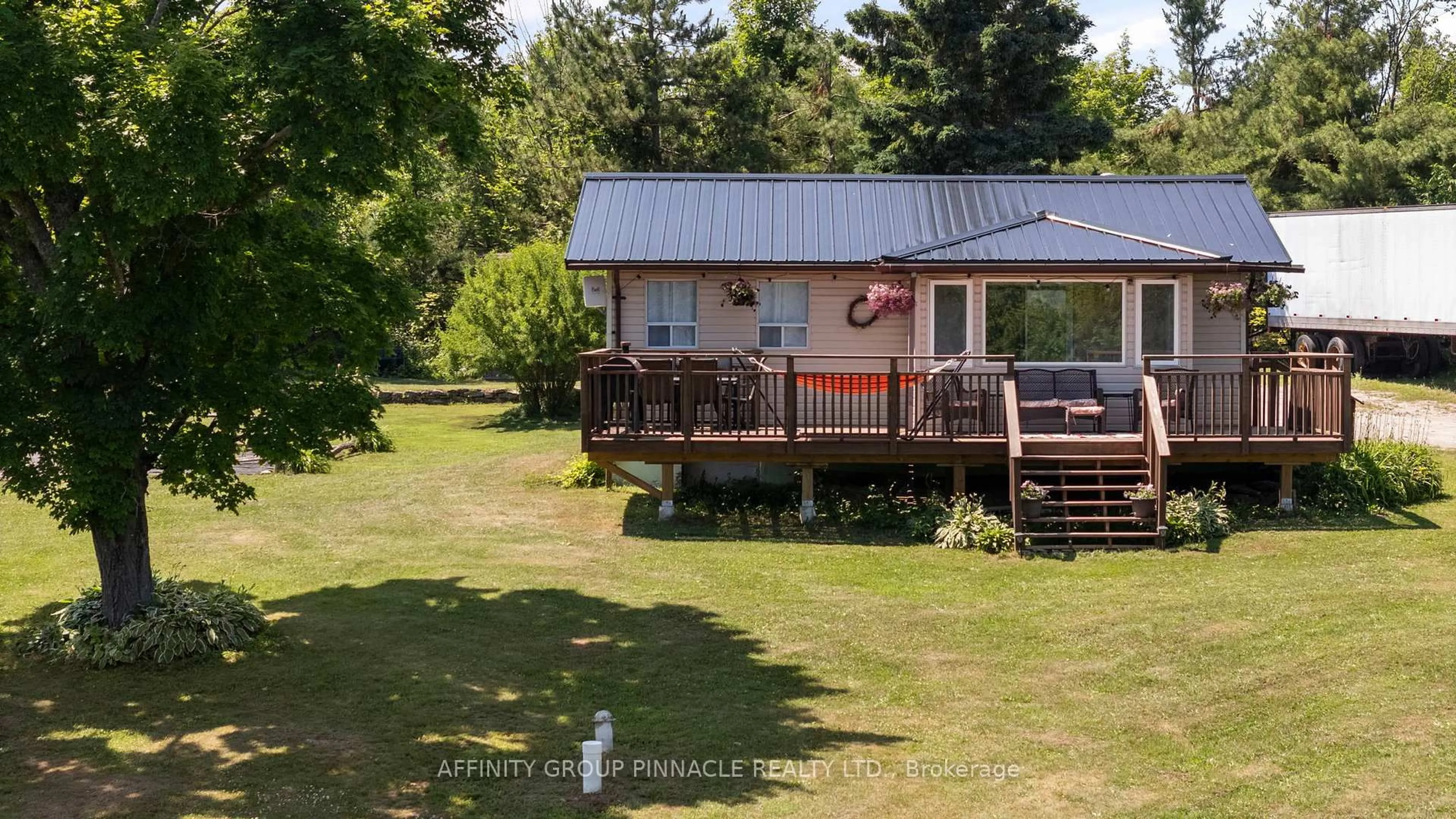 A pic from outside/outdoor area/front of a property/back of a property/a pic from drone, water/lake/river/ocean view for 2378 Monck Rd, Kawartha Lakes Ontario K0M 2B0
