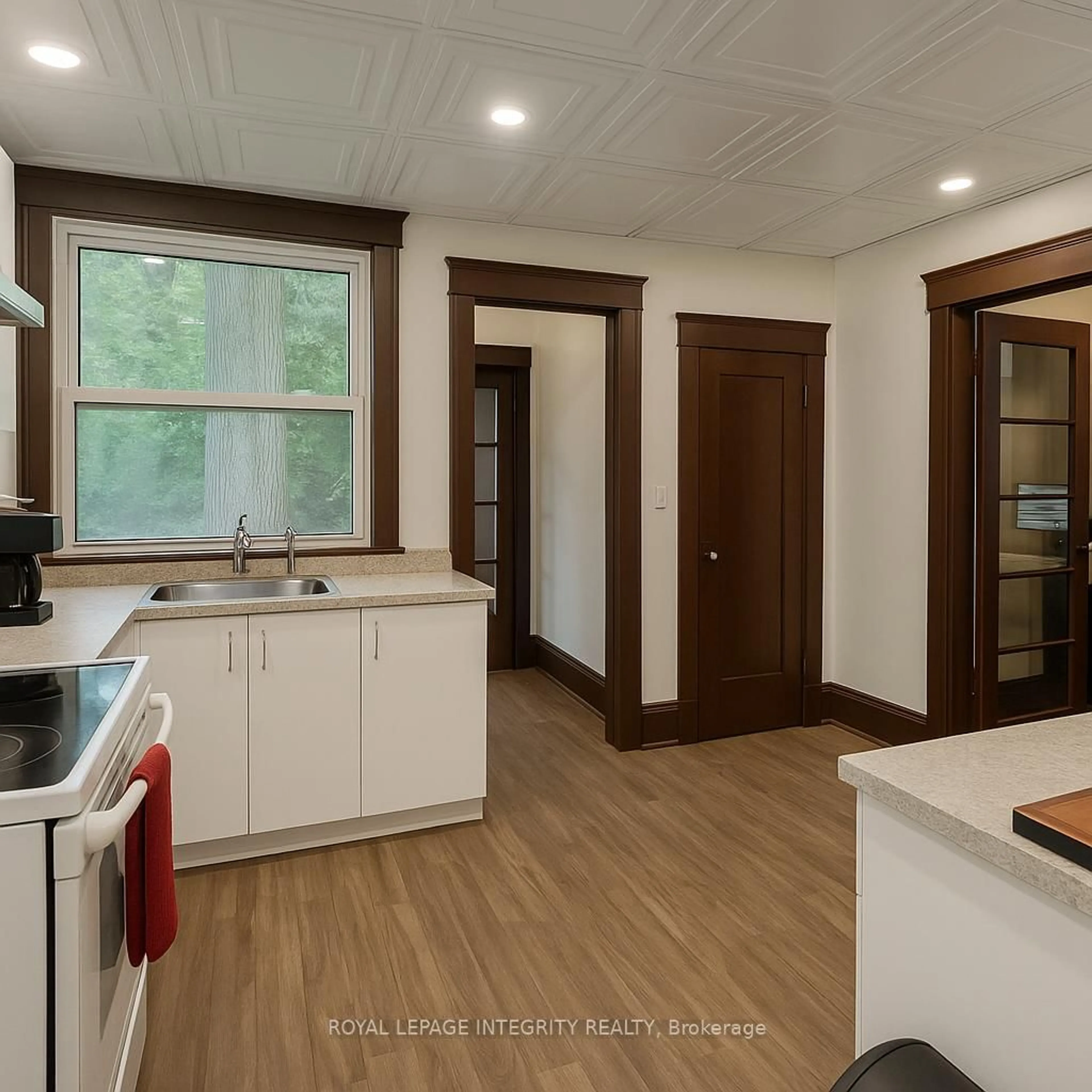 Open concept kitchen, wood/laminate floor for 1031 Carling Ave, Ottawa Ontario K1Y 4E8