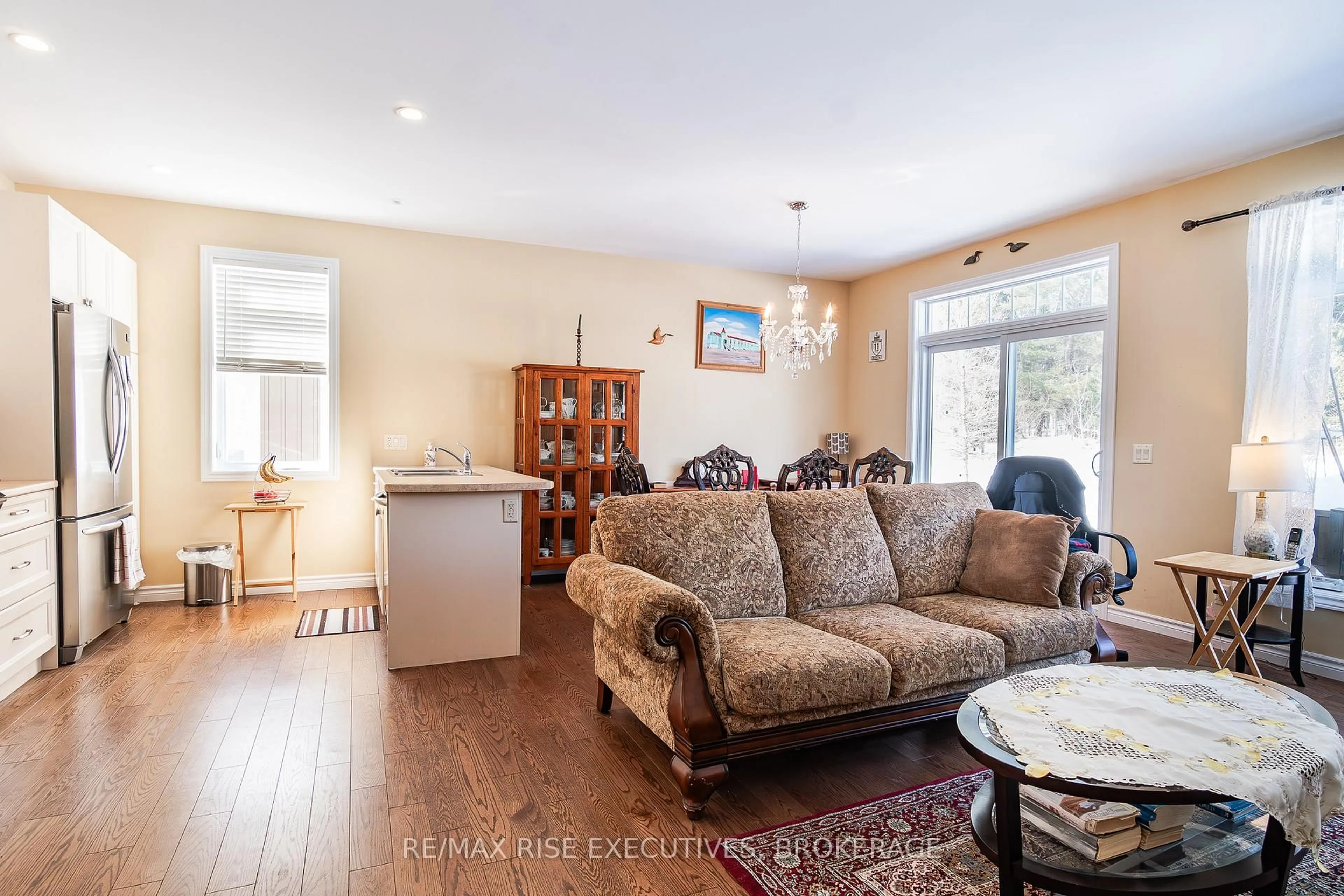 Living room with furniture, wood/laminate floor for 7 Autumn Lane #4, Huntsville Ontario P1H 0C7