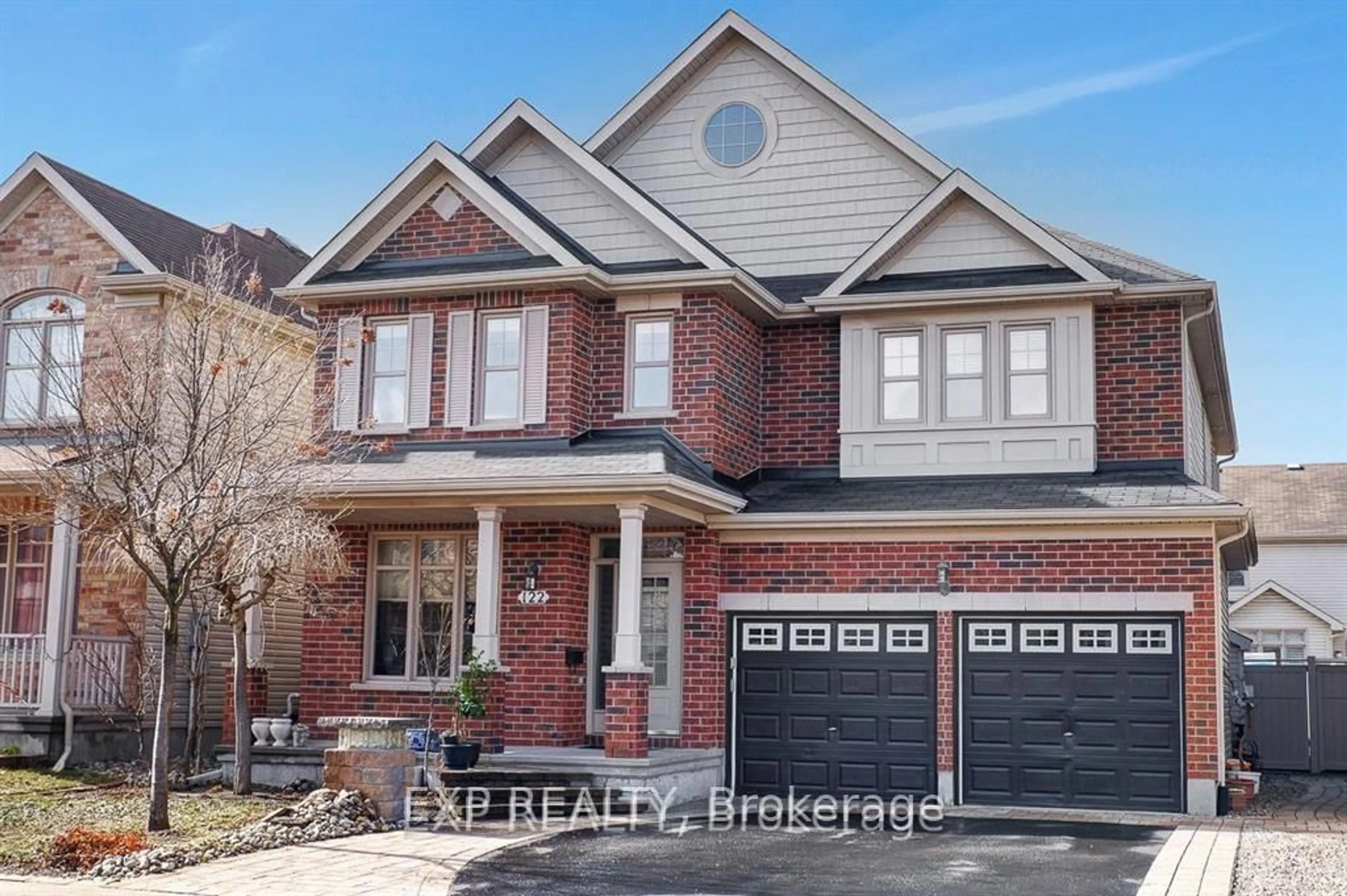 Home with brick exterior material, street for 122 Rodeo Dr, Barrhaven Ontario K2J 5K3