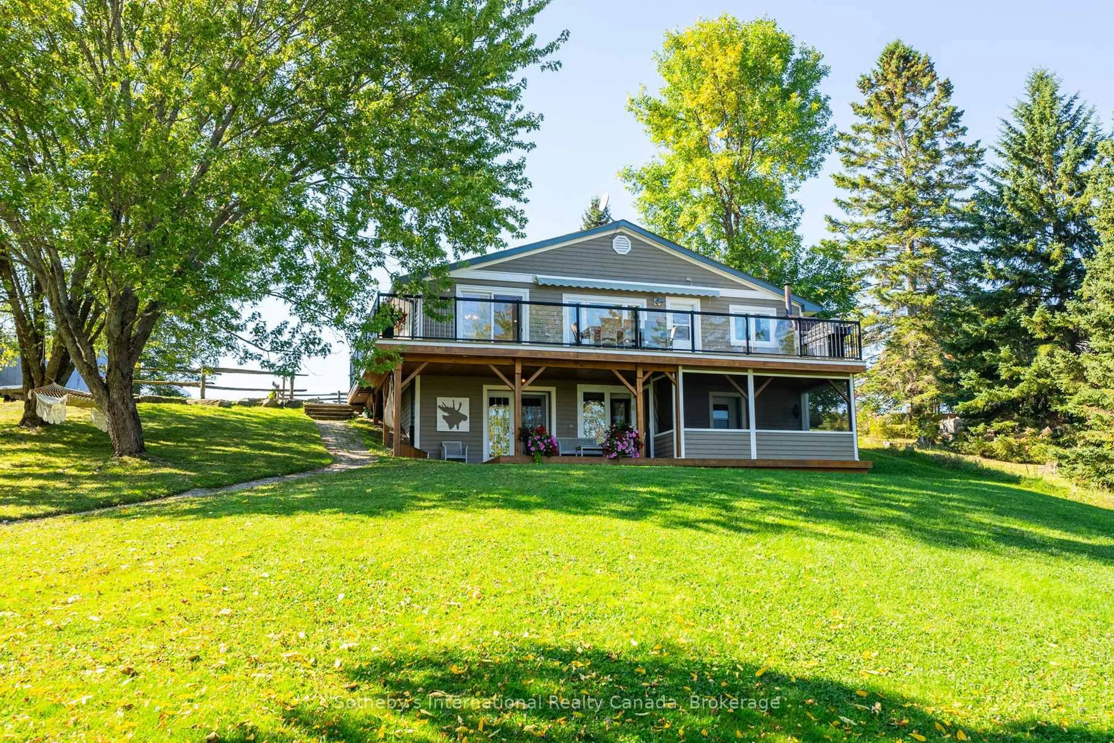 A pic from outside/outdoor area/front of a property/back of a property/a pic from drone, water/lake/river/ocean view for 1111 Maplehurst Dr, Lake of Bays Ontario P1H 2J6