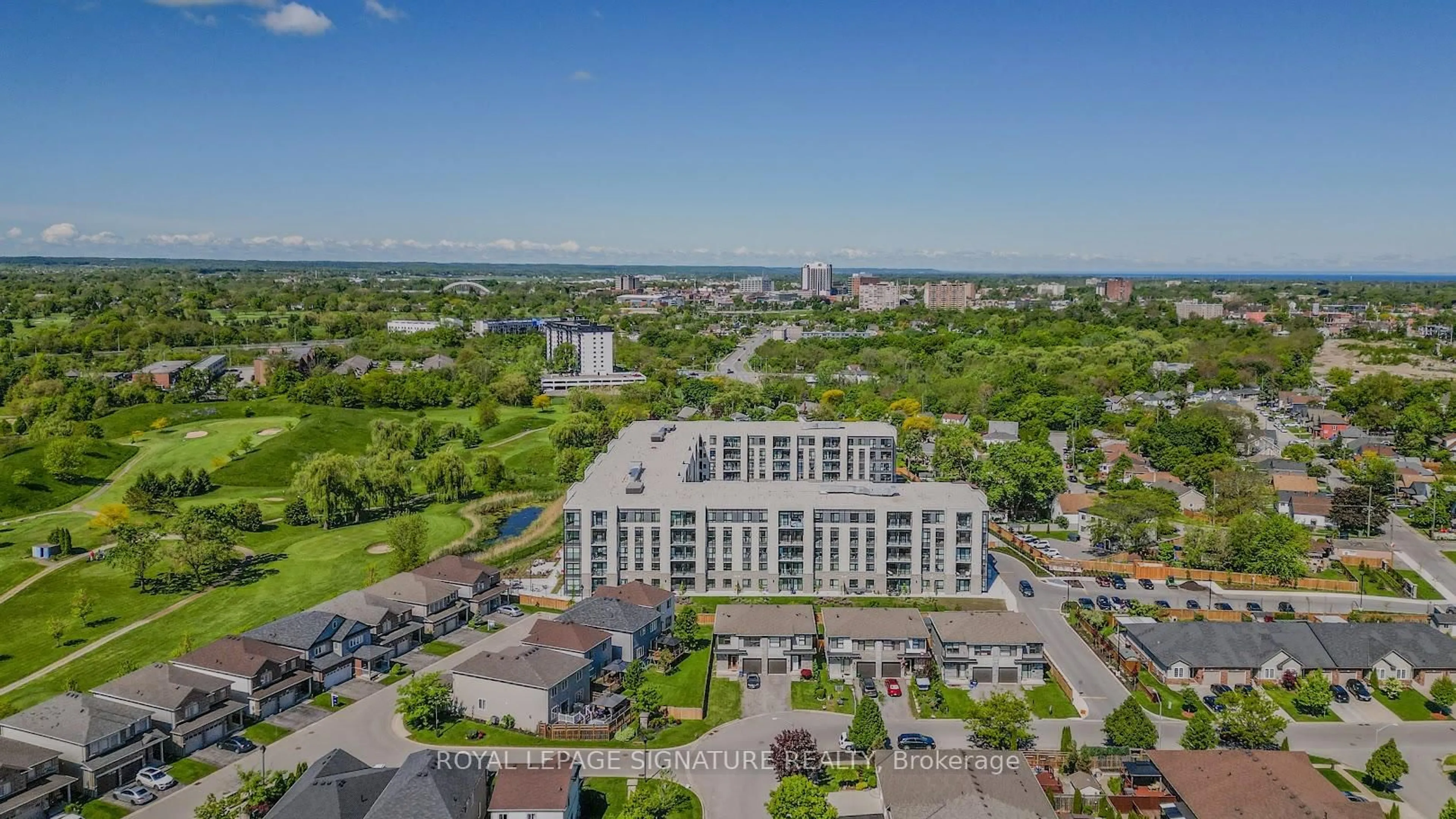 A pic from outside/outdoor area/front of a property/back of a property/a pic from drone, city buildings view from balcony for 50 Herrick Ave #UP27, St. Catharines Ontario L2P 0G3