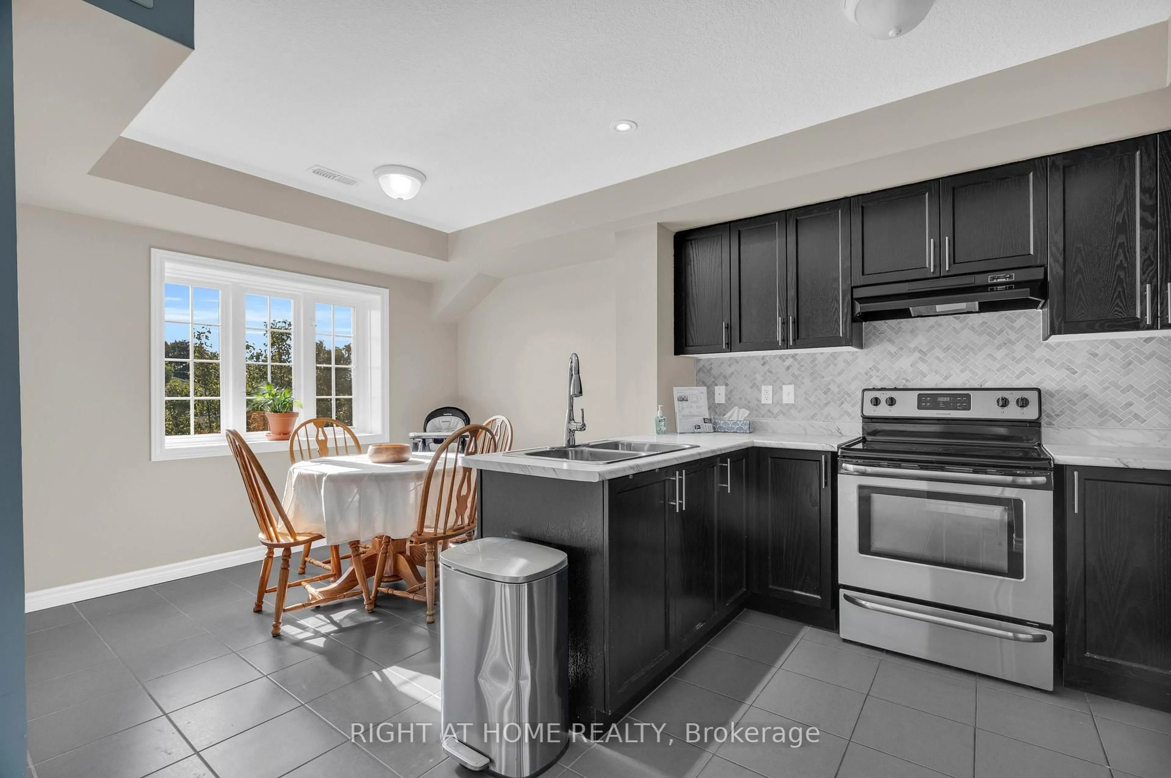 Open concept kitchen, ceramic/tile floor for 630 Woodlawn Rd #B, Guelph Ontario N1E 0K4